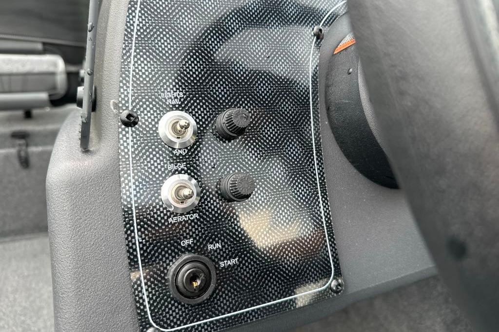 Control panel of 2026 Tracker Bass Tracker Classic XL boat with switches and ignition.
