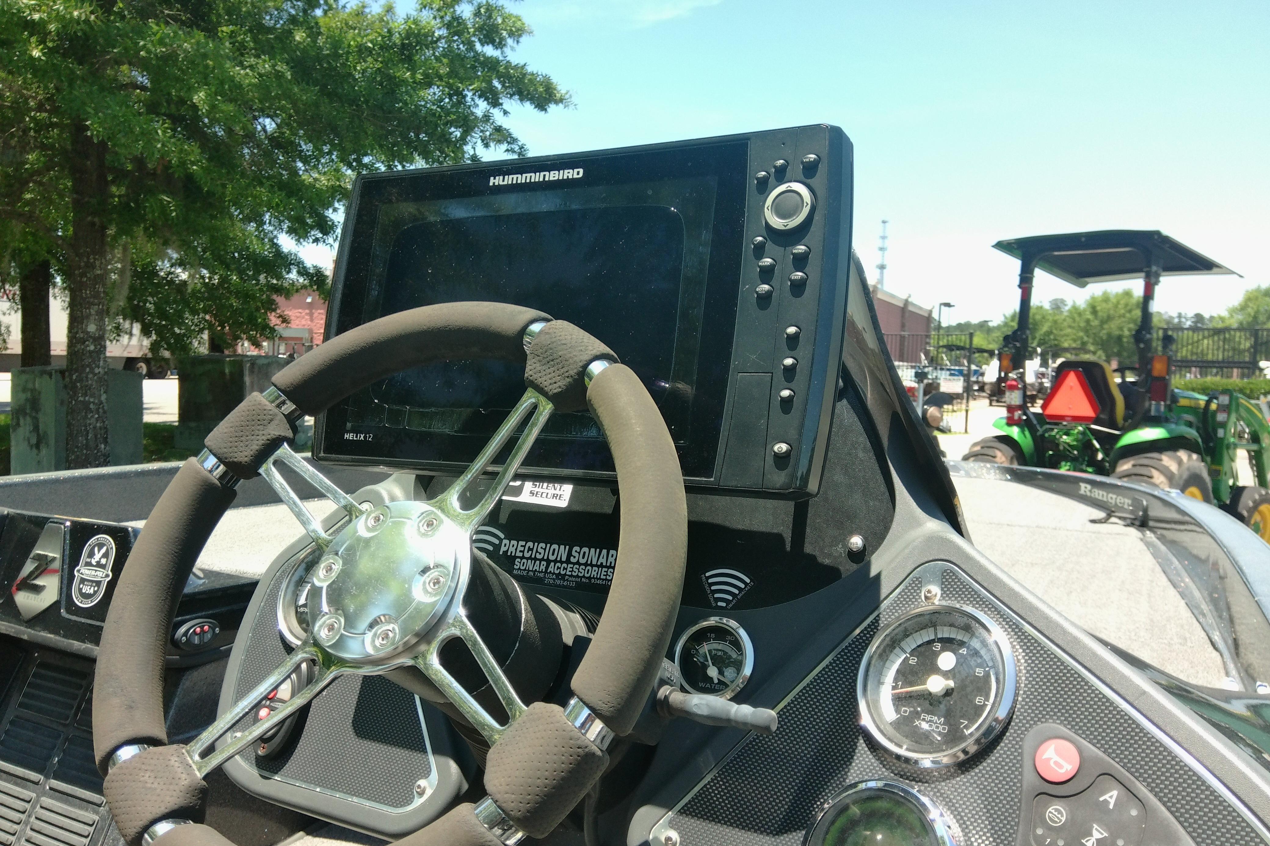 Steering console of 2012 Ranger Z520 boat with Humminbird electronics and sonar accessories.