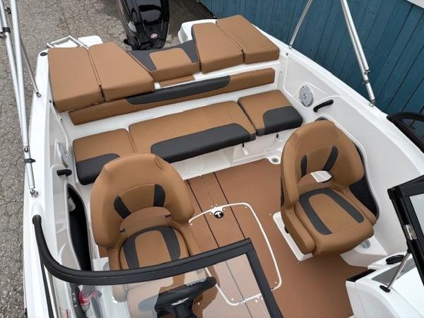 2025 Tahoe 185 S boat interior with tan and black seating, featuring a modern design.
