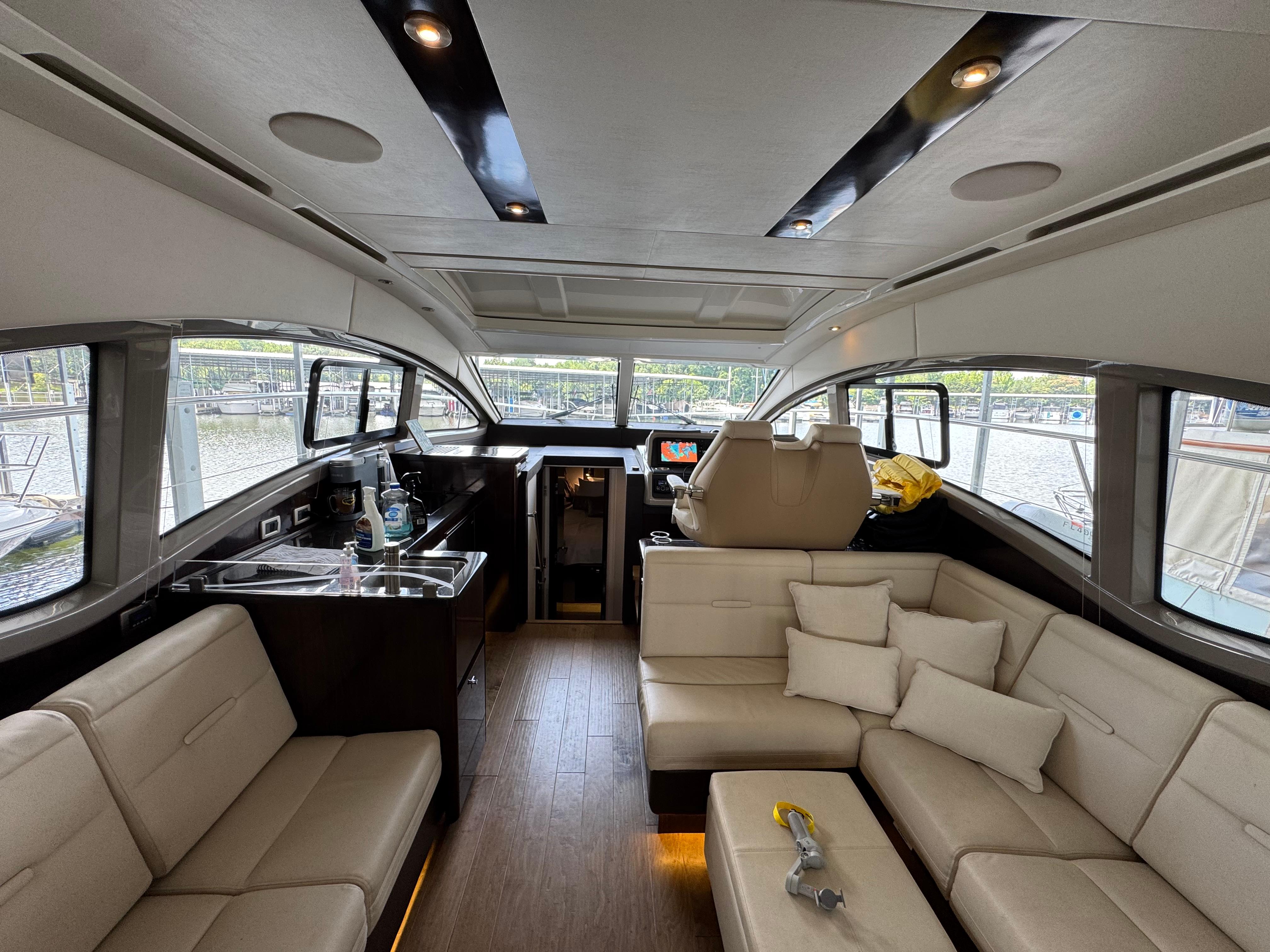 Luxurious interior of 2017 Sea Ray Sundancer 400 yacht with plush seating and modern amenities.