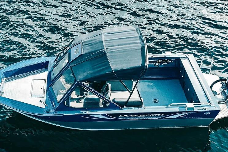 2026 Duckworth 18 Advantage boat on water, featuring a canopy and sleek design.
