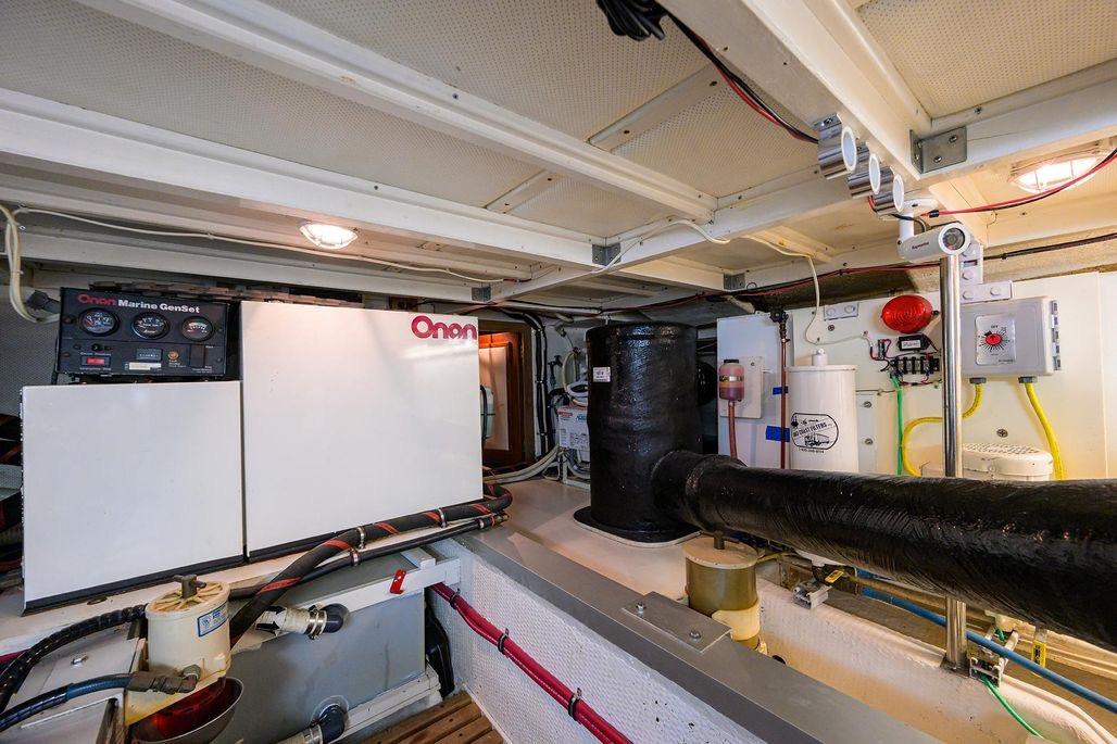 Engine room of 1999 Grand Banks 42 Europa with Onan Marine GenSet.