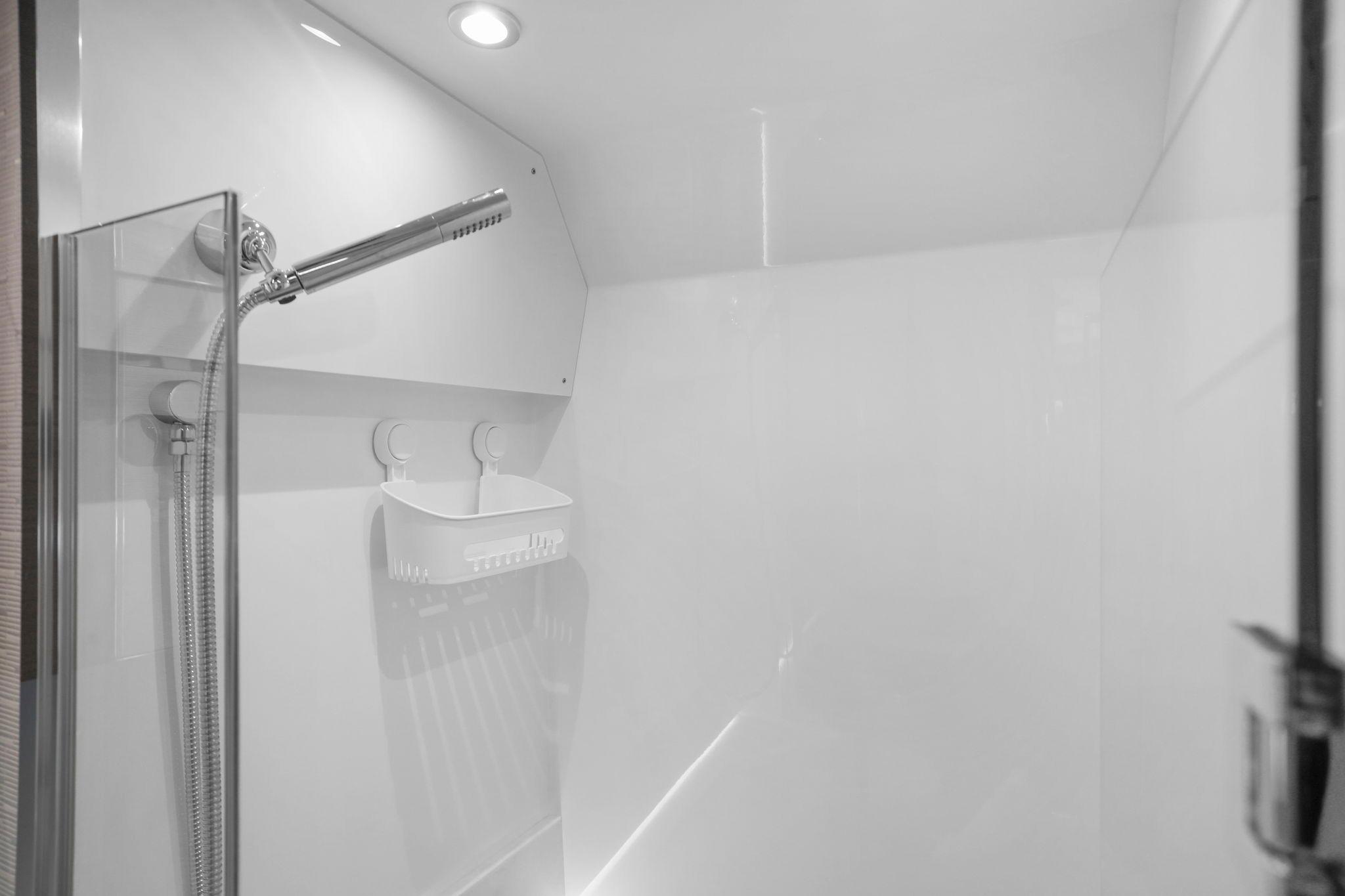 Modern shower area in 2023 Tiara Yachts C49 Coupe, featuring sleek design and fixtures.