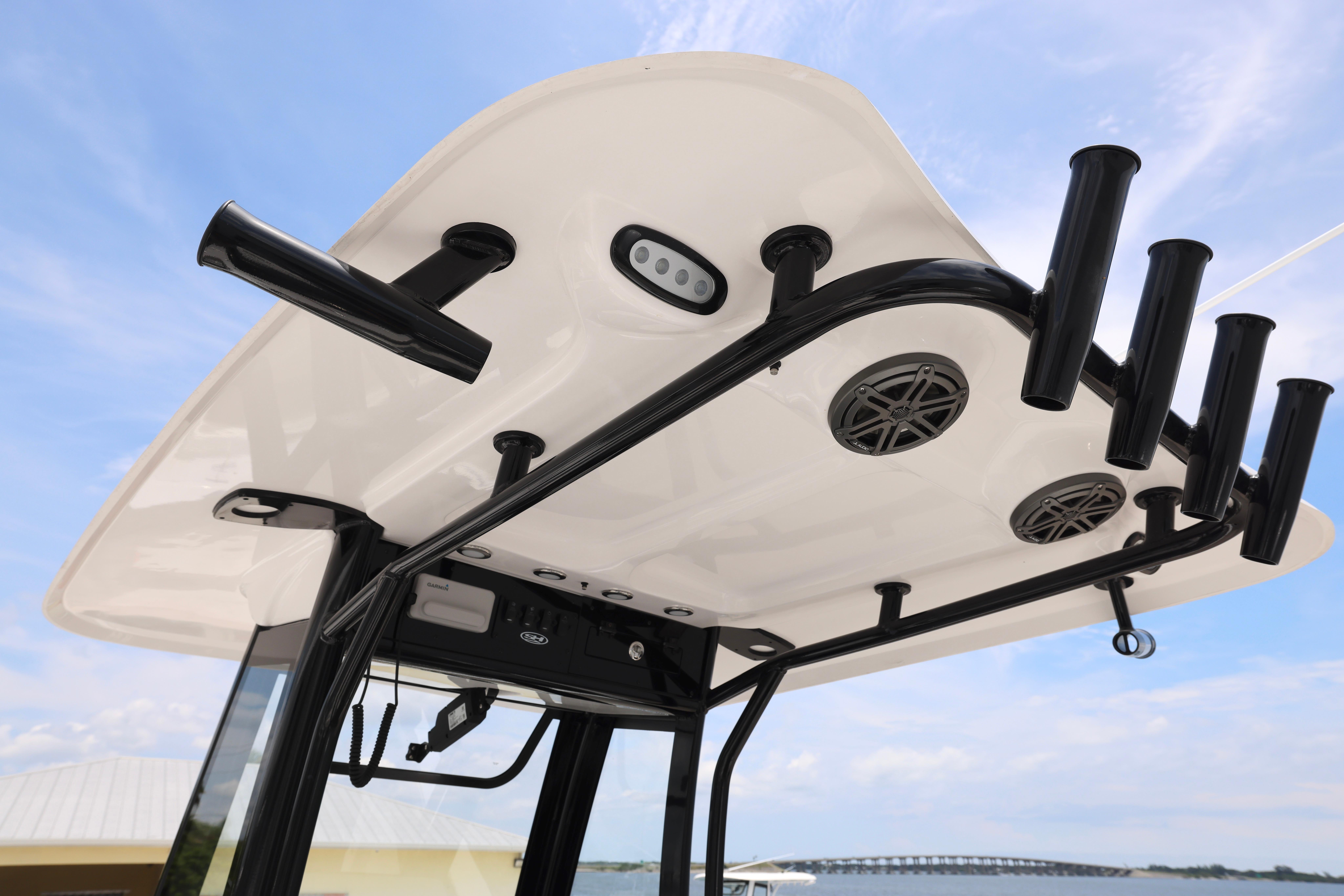 T-top of 2026 Sea Hunt Ultra 245 SE boat with rod holders and speakers.
