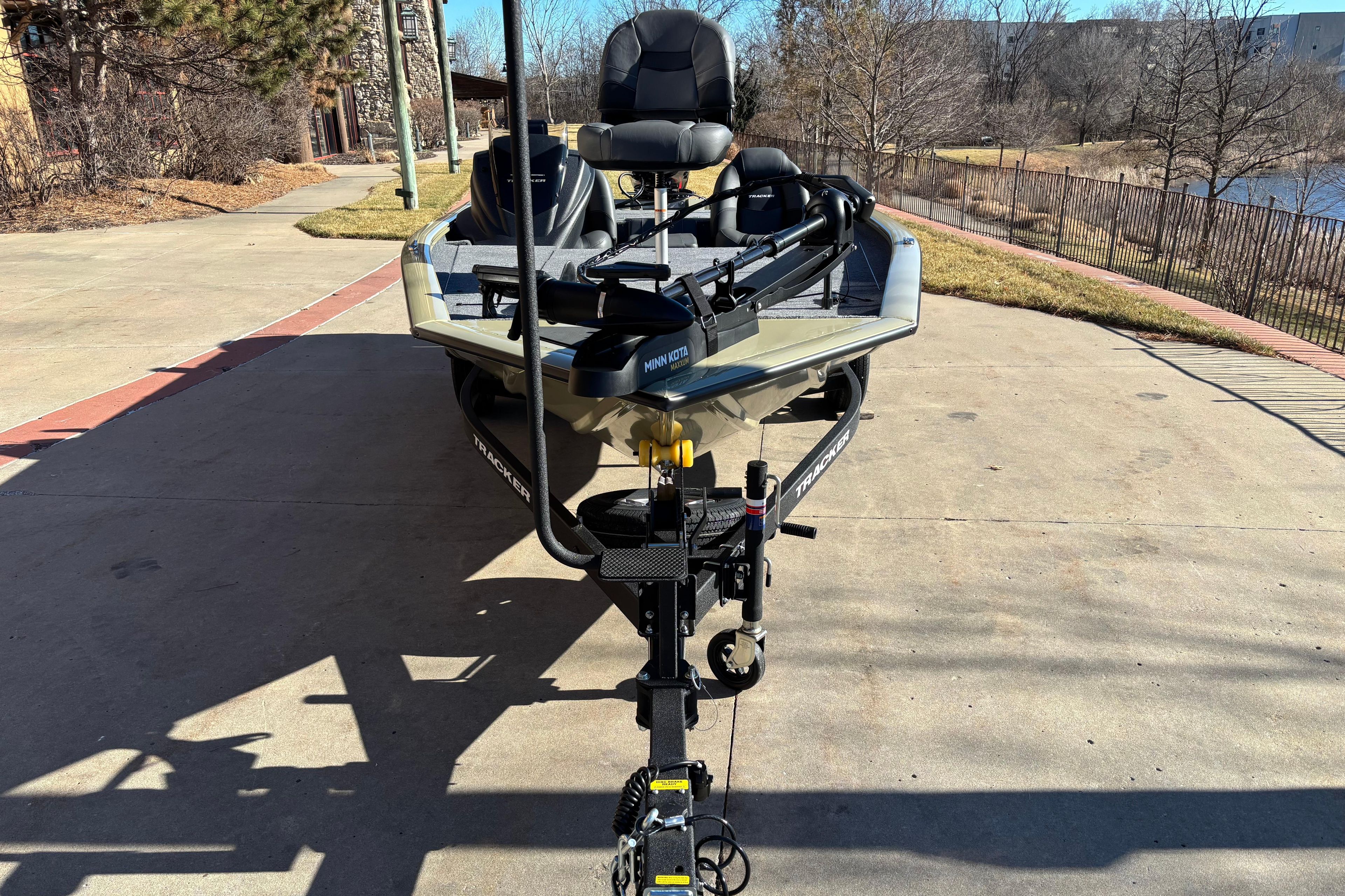 2026 Tracker Pro Team 195 boat on trailer, parked outdoors on a sunny day.