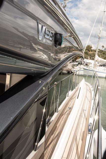 2024 Princess V55 yacht docked, showcasing sleek design and luxury features.