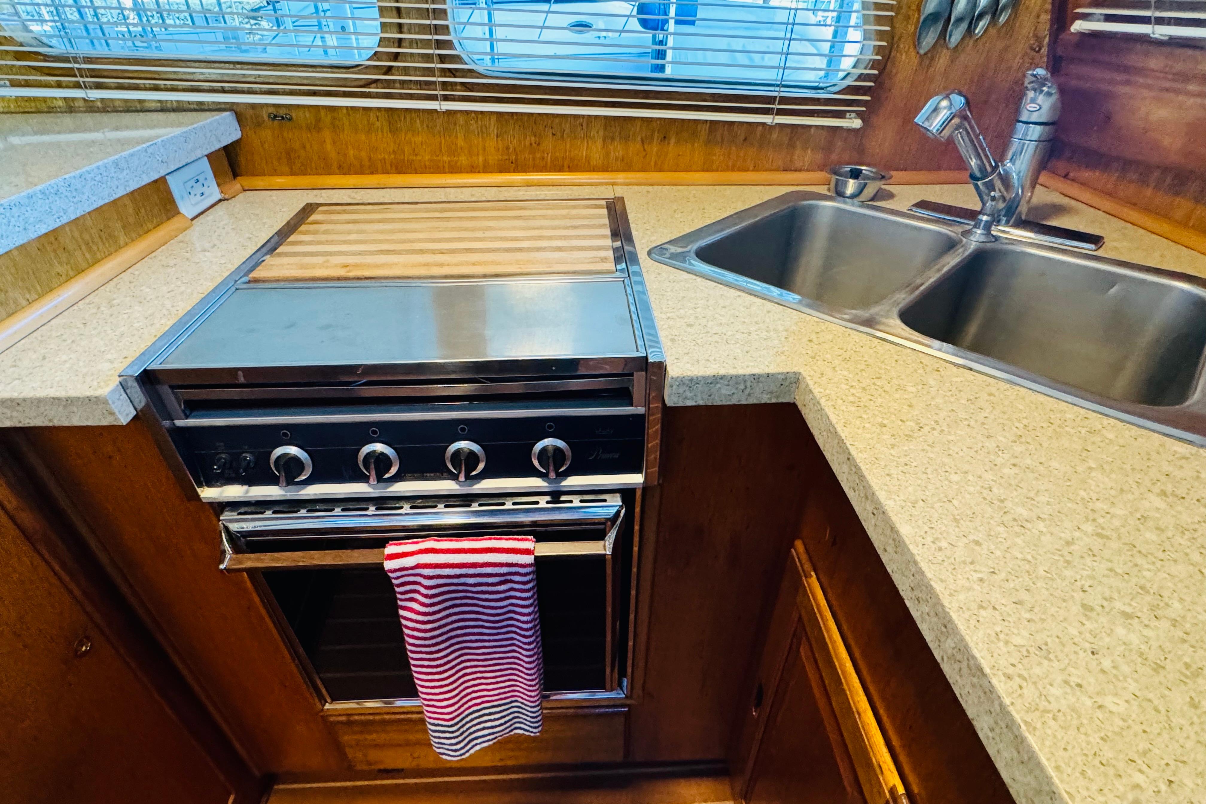 1978 Californian 42 LRC yacht kitchen with stove, double sink, and countertop.