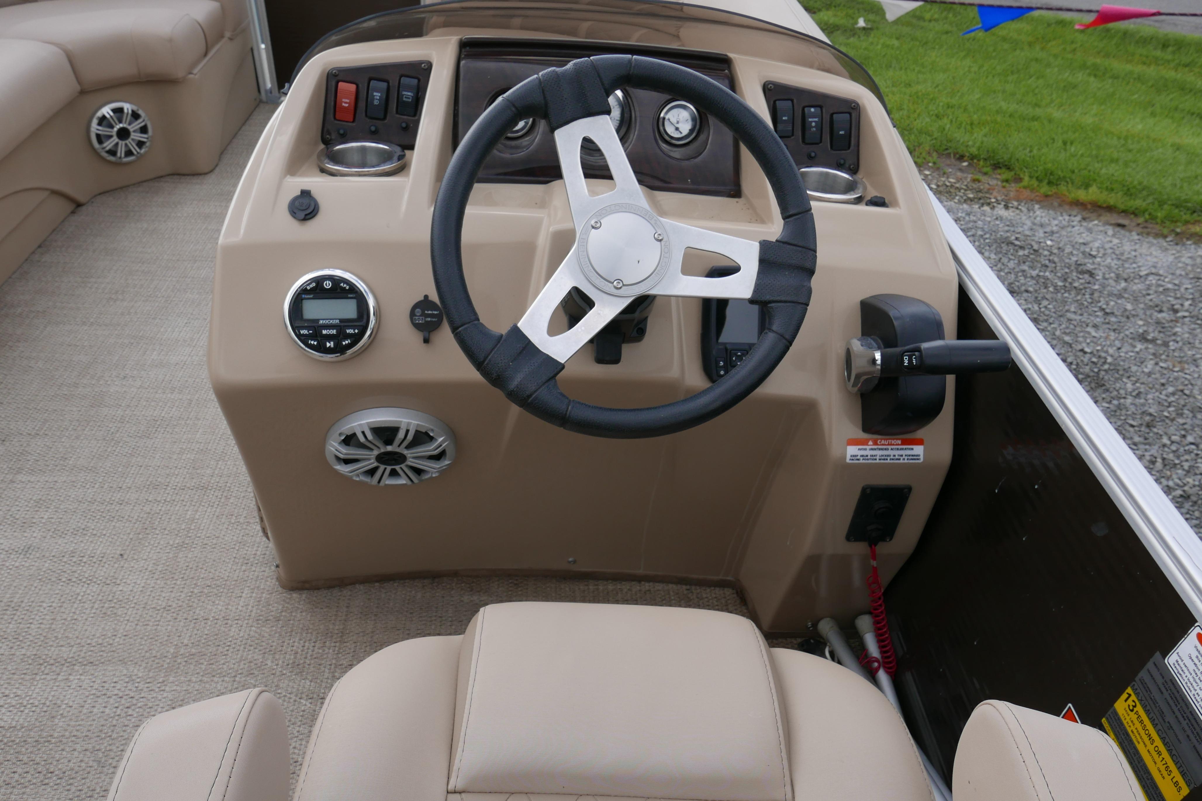 2018 Bennington 22 SSRX boat dashboard with steering wheel and control panel.