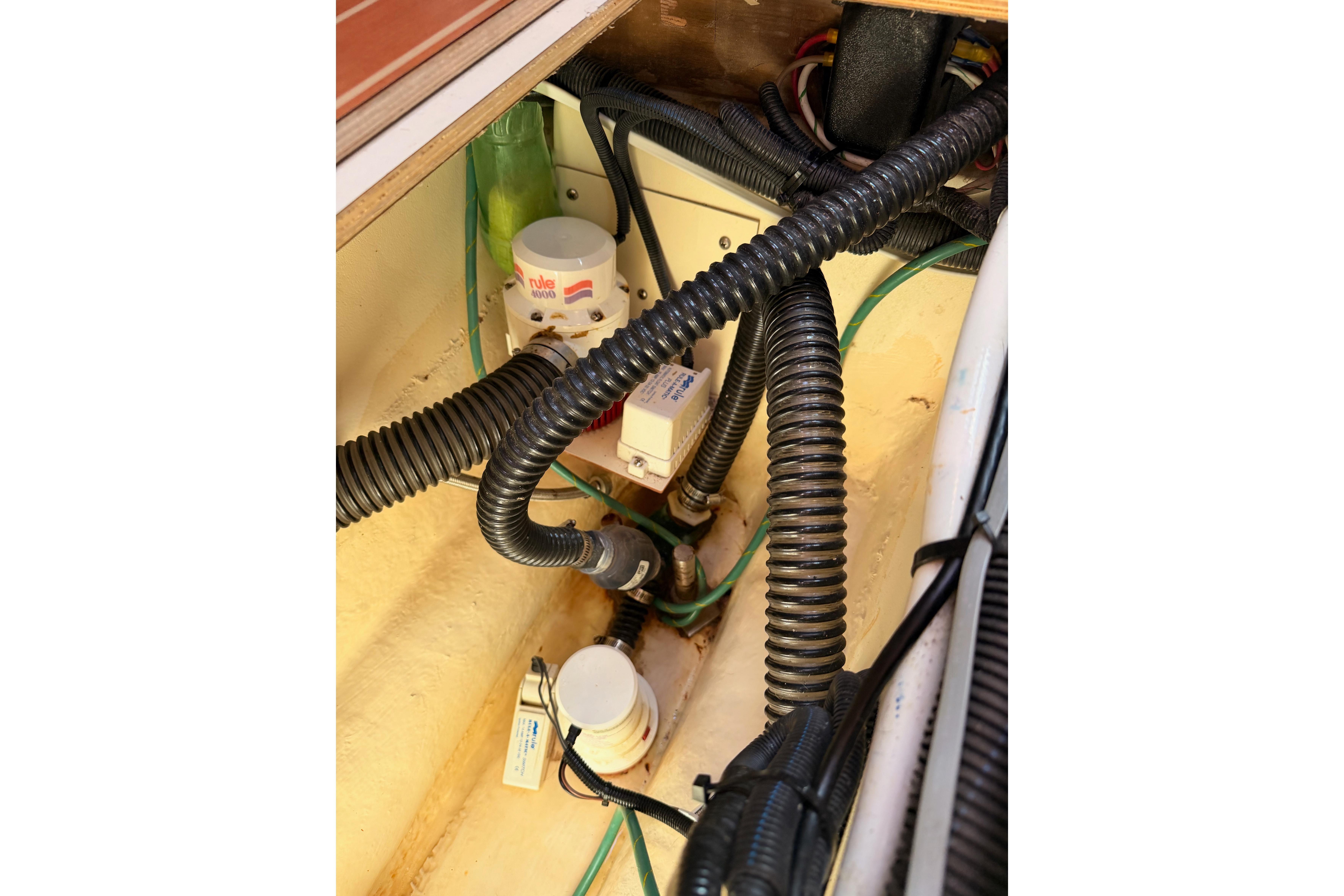 Engine compartment of 2008 Hunter 45 Deck Salon with wiring and components visible.