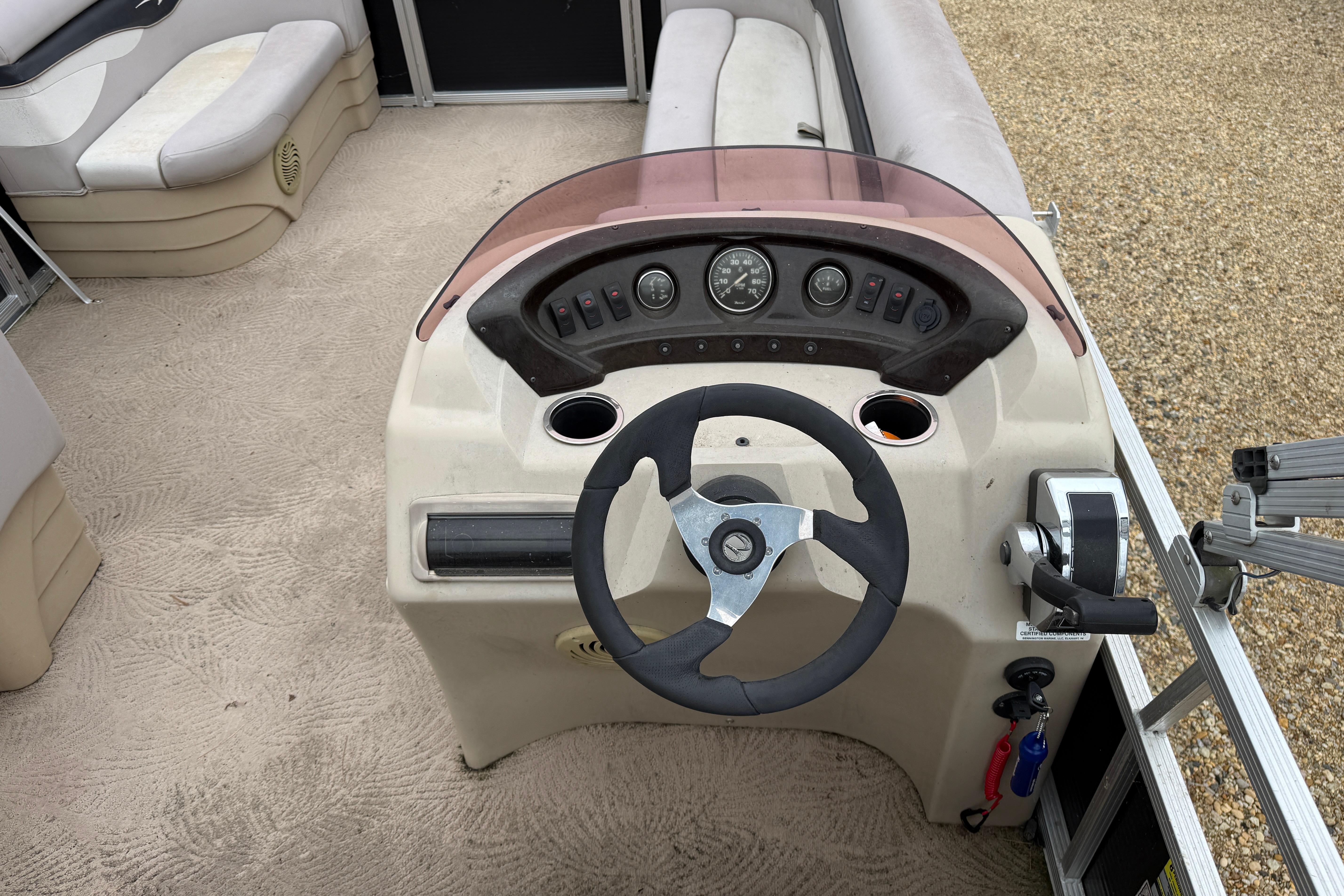 2010 Bennington 20SLi boat interior with steering wheel and dashboard controls.