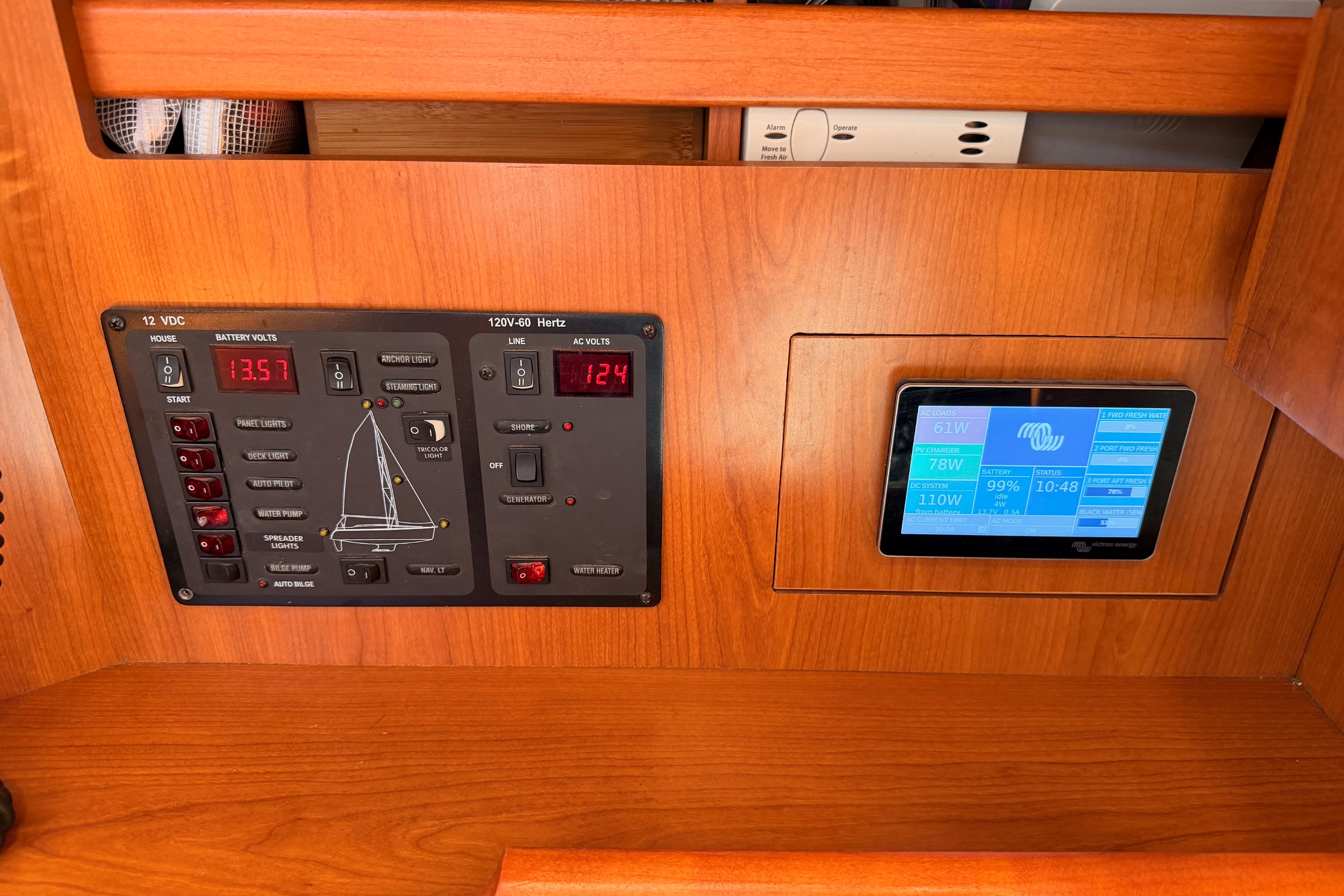 Control panel of a 2008 Hunter 45 Deck Salon sailboat with digital display.