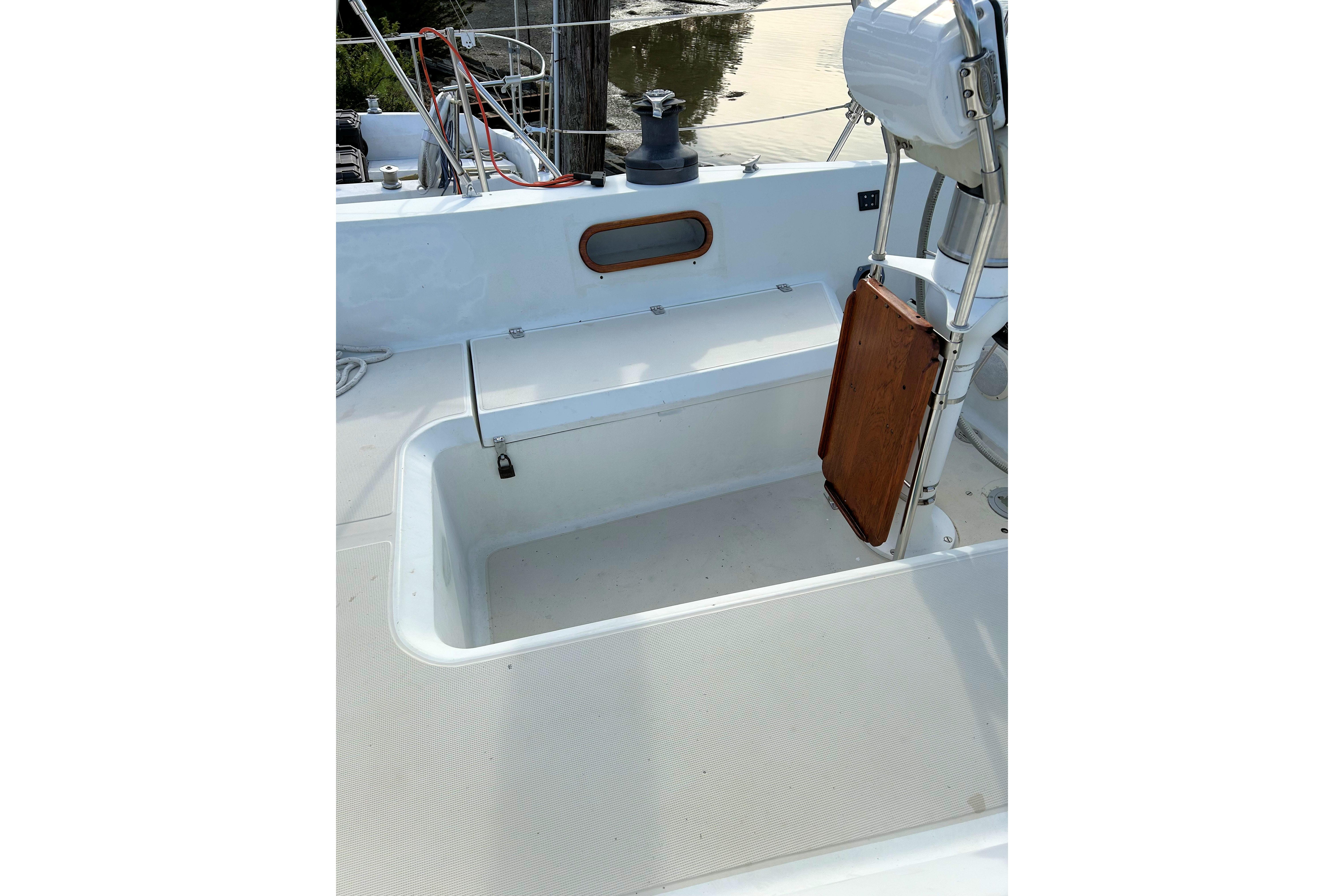 Cockpit of 1987 Ericson 38-200 sailboat with seating and storage area.