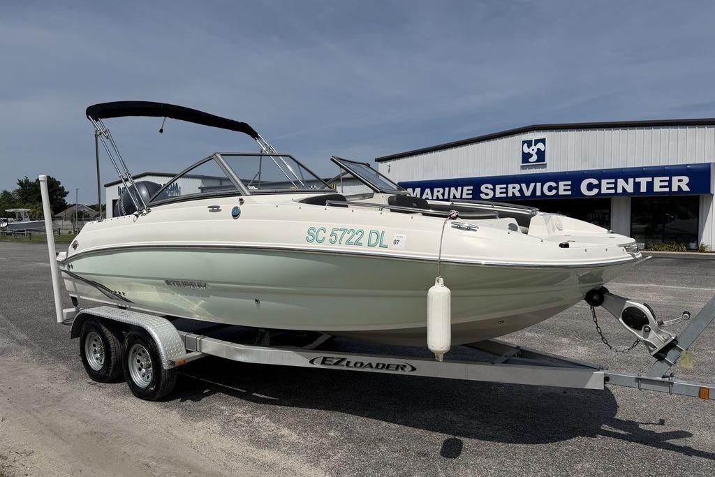2019 Stingray 201 DS boat on trailer at marine service center.