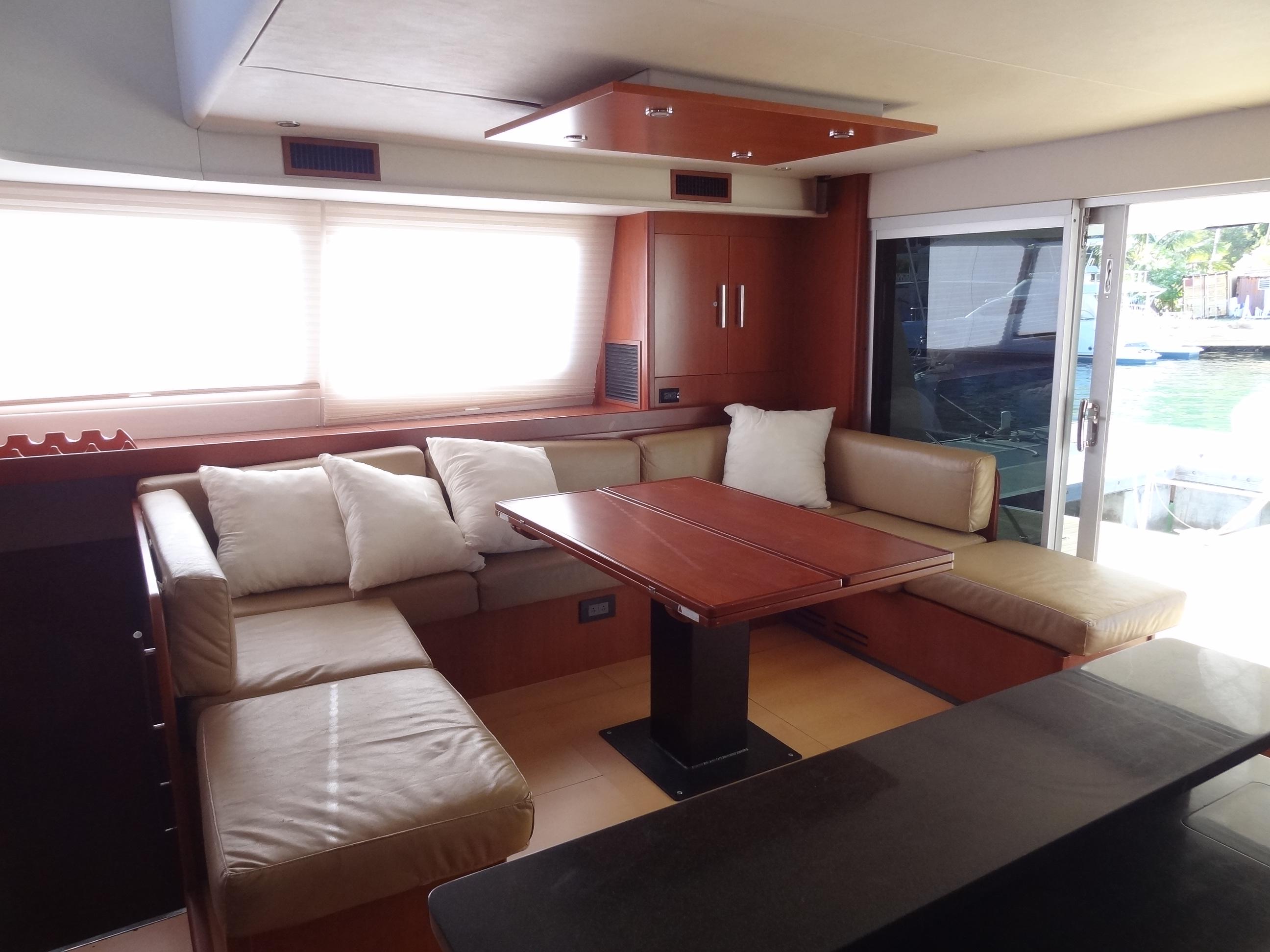 Luxurious interior of a 2014 Leopard 58 yacht with a spacious seating area.