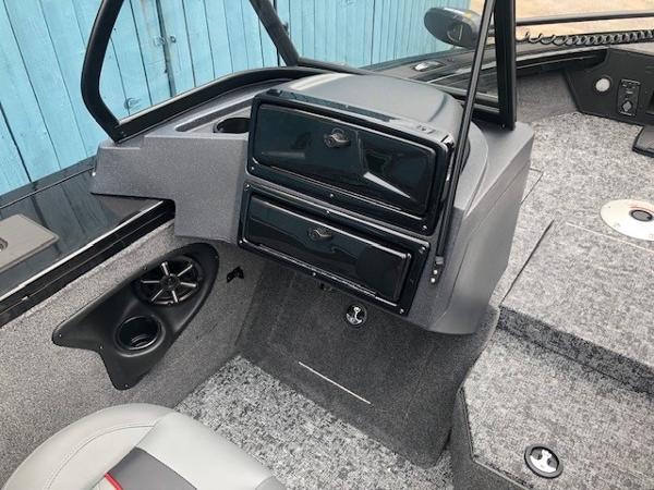 2025 Tracker Targa V18 Combo boat interior with storage compartments and speaker.