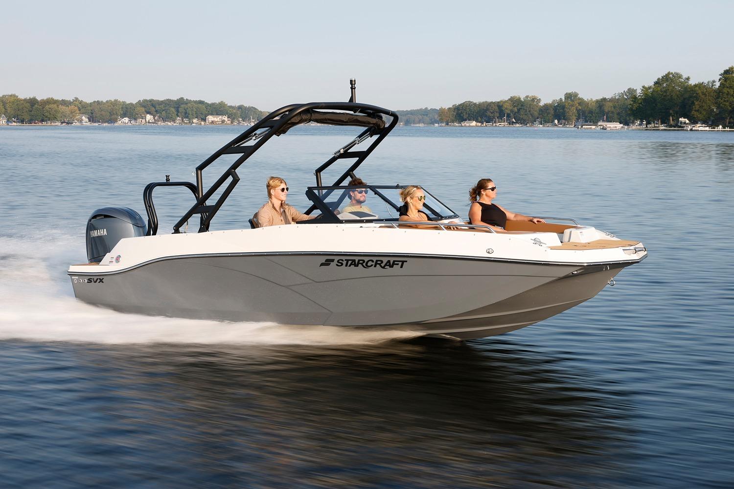 Manufacturer Provided Image: 2026 Starcraft SVX 210 DC OB boat cruising on a serene lake with passengers.