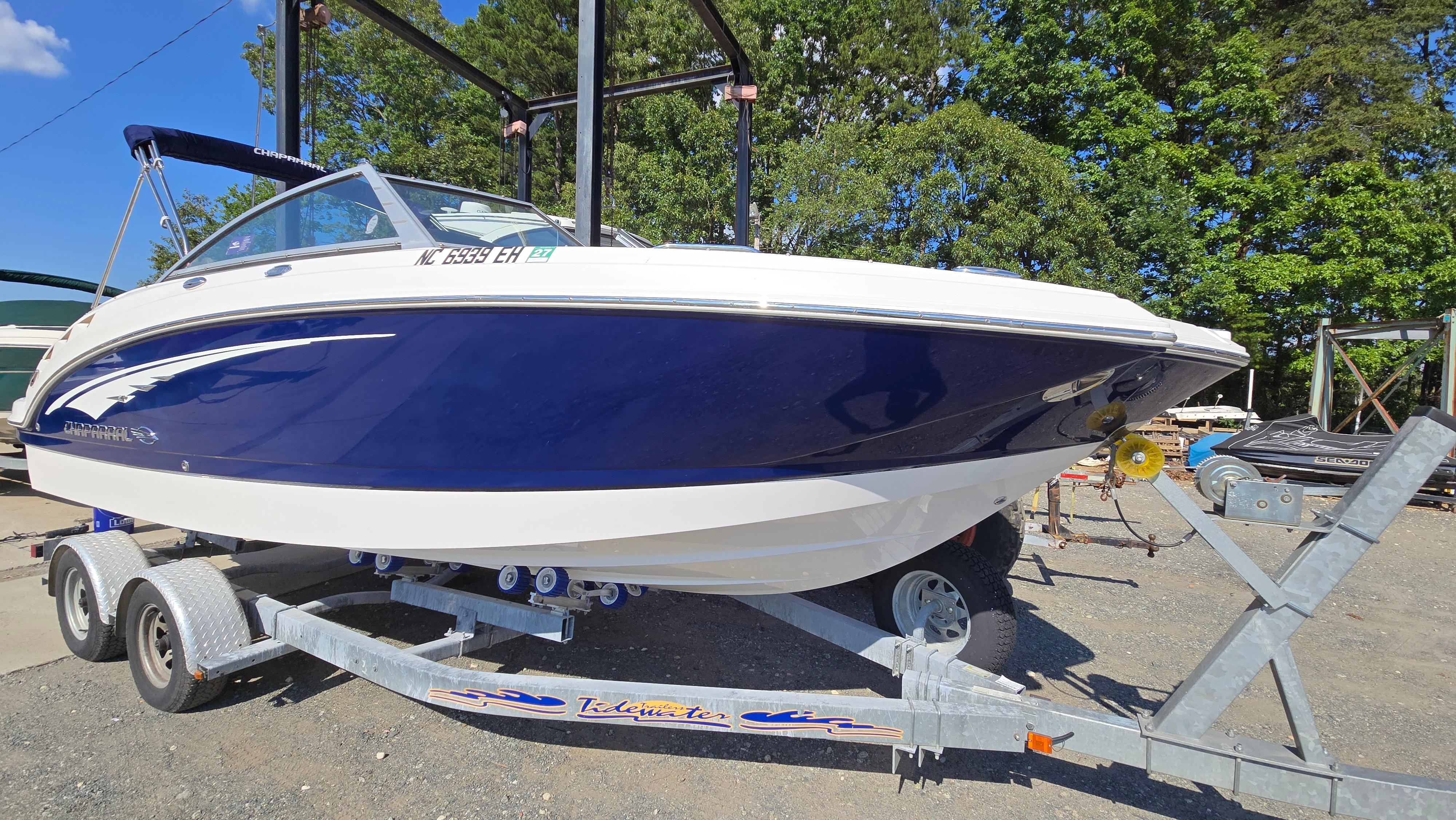 2018 Chaparral 224 Sunesta boat on trailer, parked outdoors.