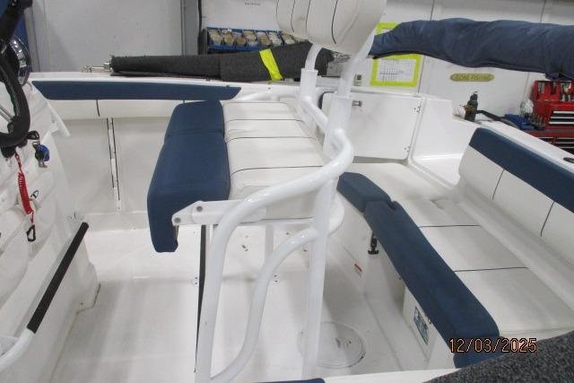2024 Tahoe 2150 CC boat interior with blue and white seating, showcasing spacious design.