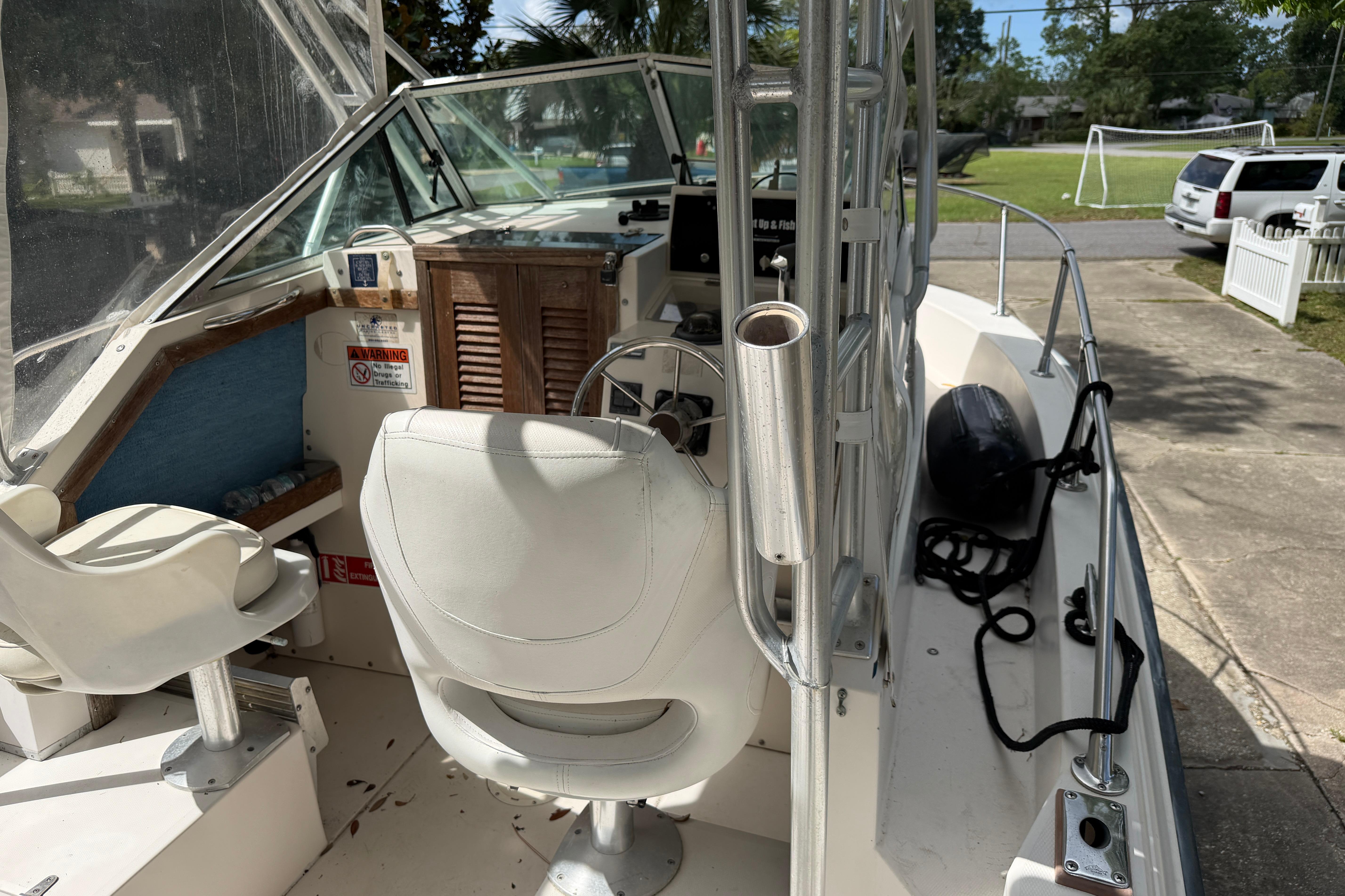 1987 Grady-White Seafarer 226 boat interior with steering wheel and seating.