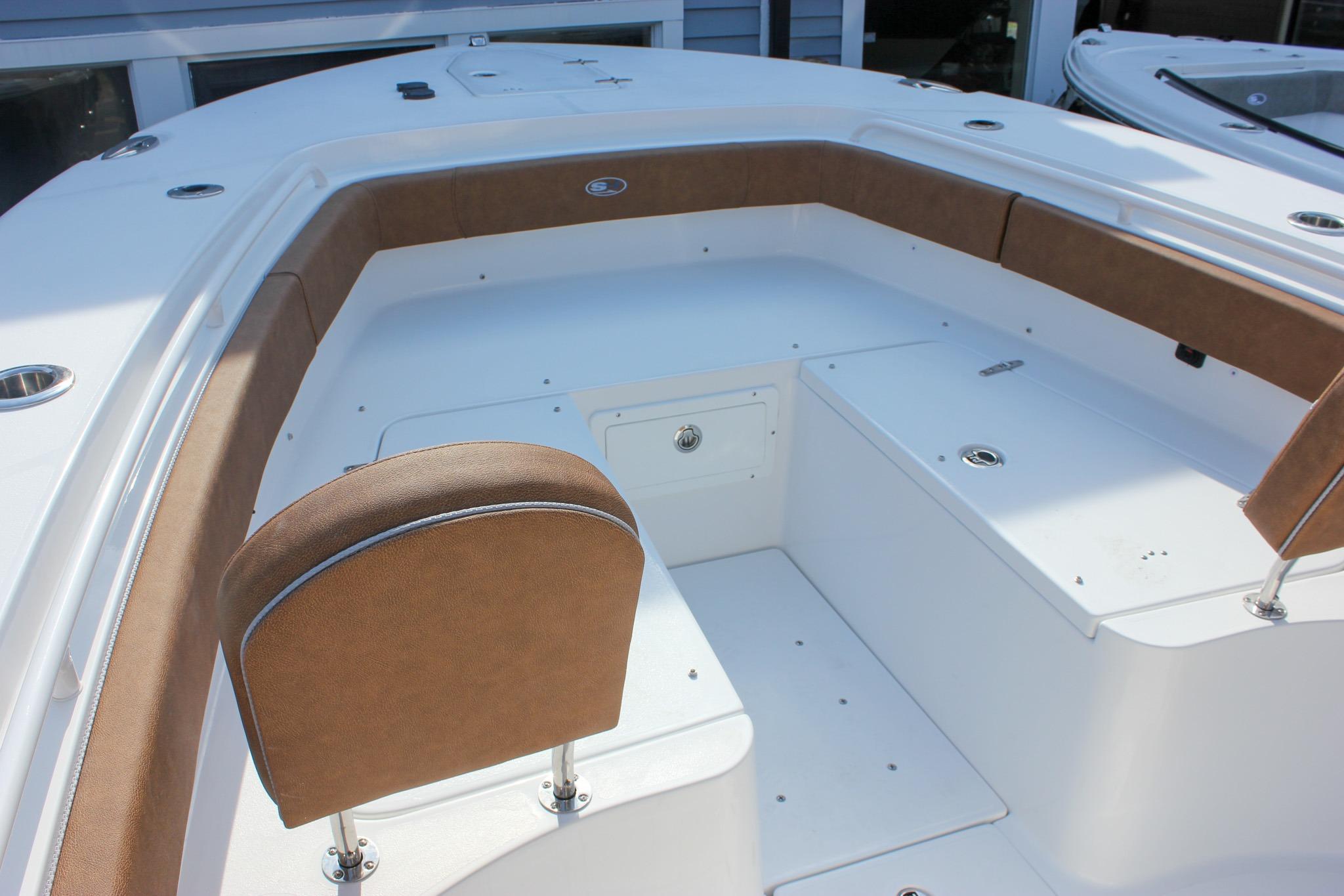 2027 Sea Hunt Ultra 275 SE boat interior with cushioned seating and storage compartments.