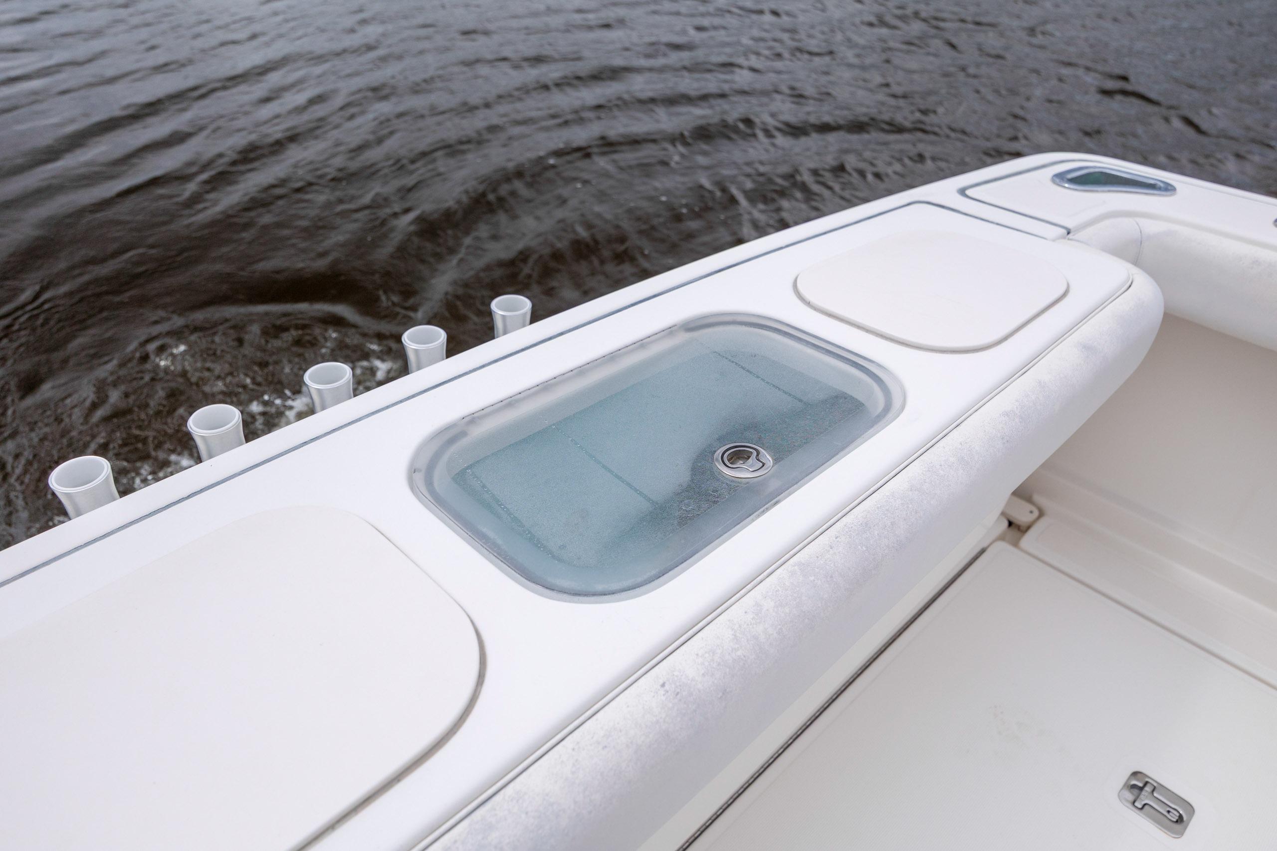2004 Tiara Yachts 3200 Open boat deck with livewell and rod holders.
