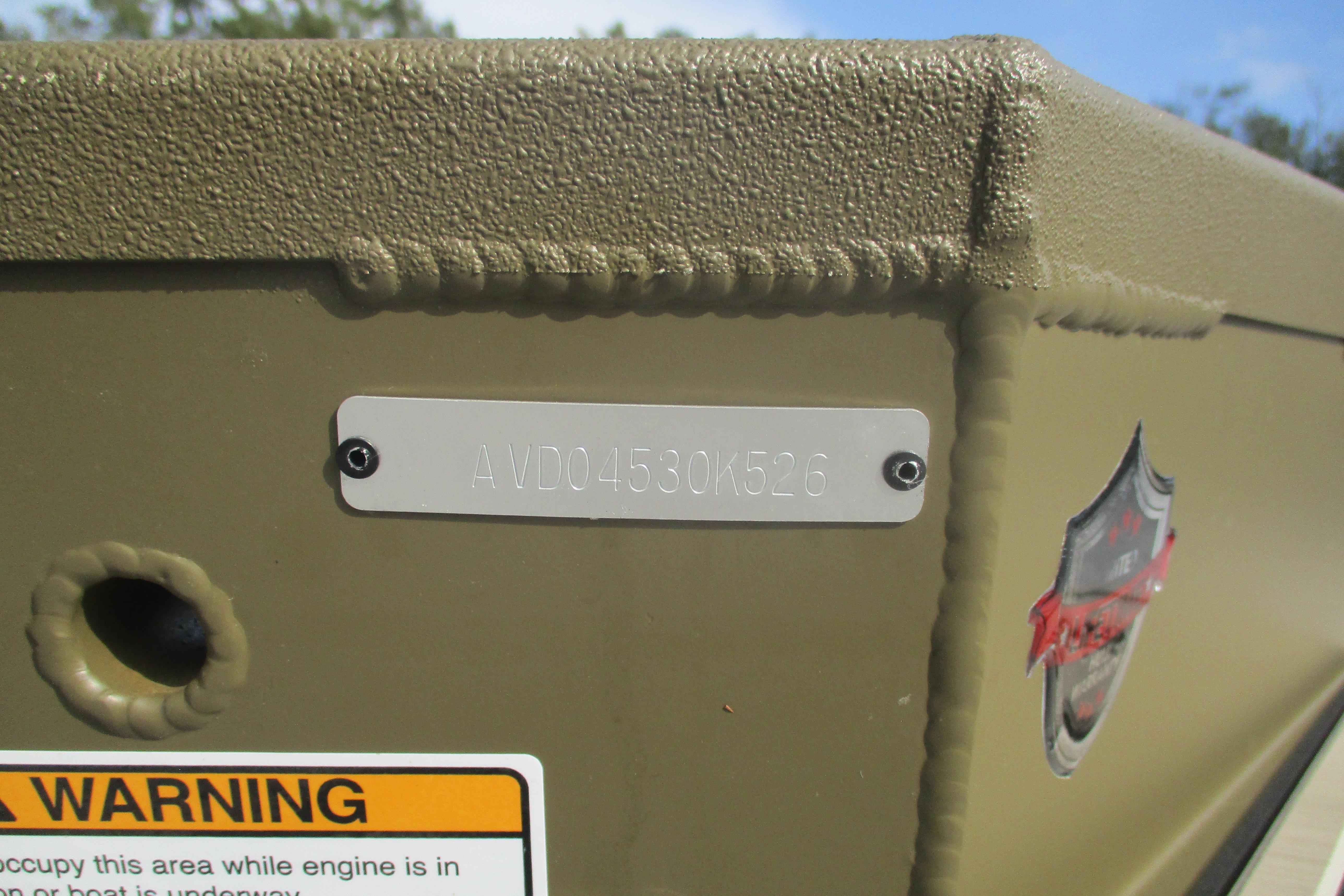 2026 Avid 16 Commander boat hull identification number and warning label.