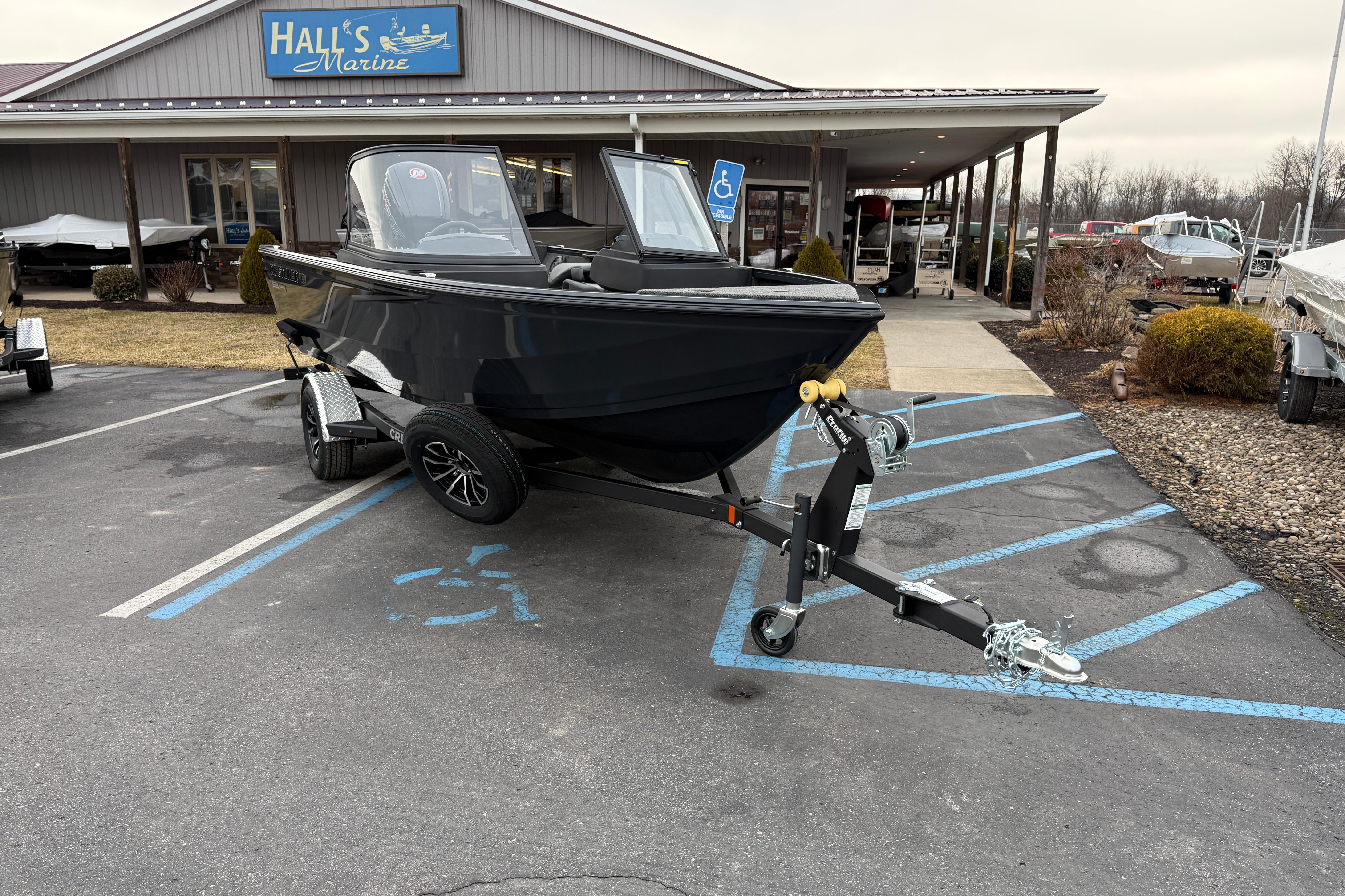 2026 Crestliner 1750 Hawk boat on trailer at Hall's Marine dealership.