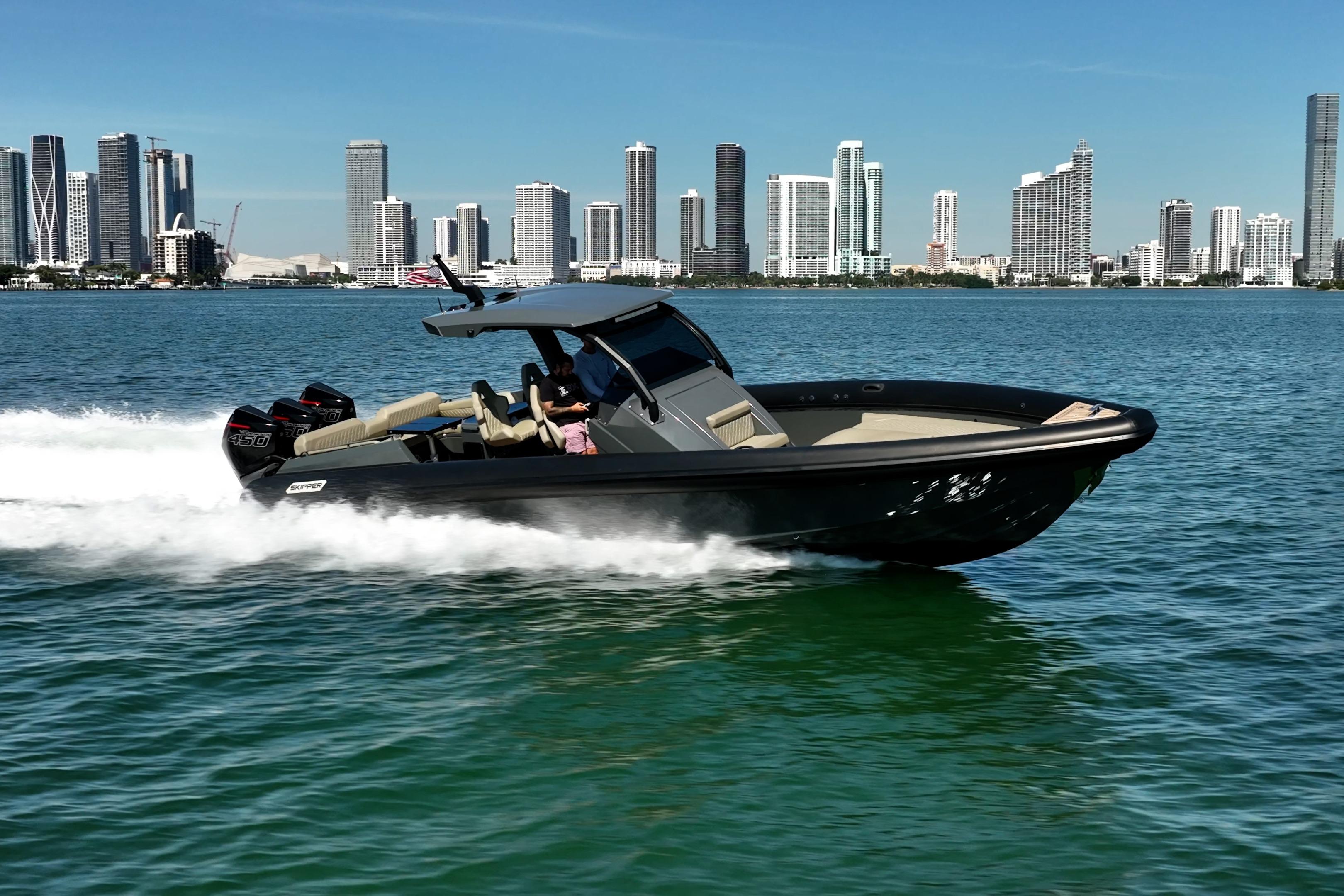 2023 Skipper-BSK 38NC boat cruising on water with city skyline backdrop.