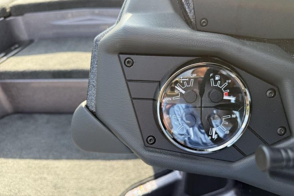 Dashboard gauges of a 2026 Skeeter ZXE20 boat, showing fuel and trim levels.