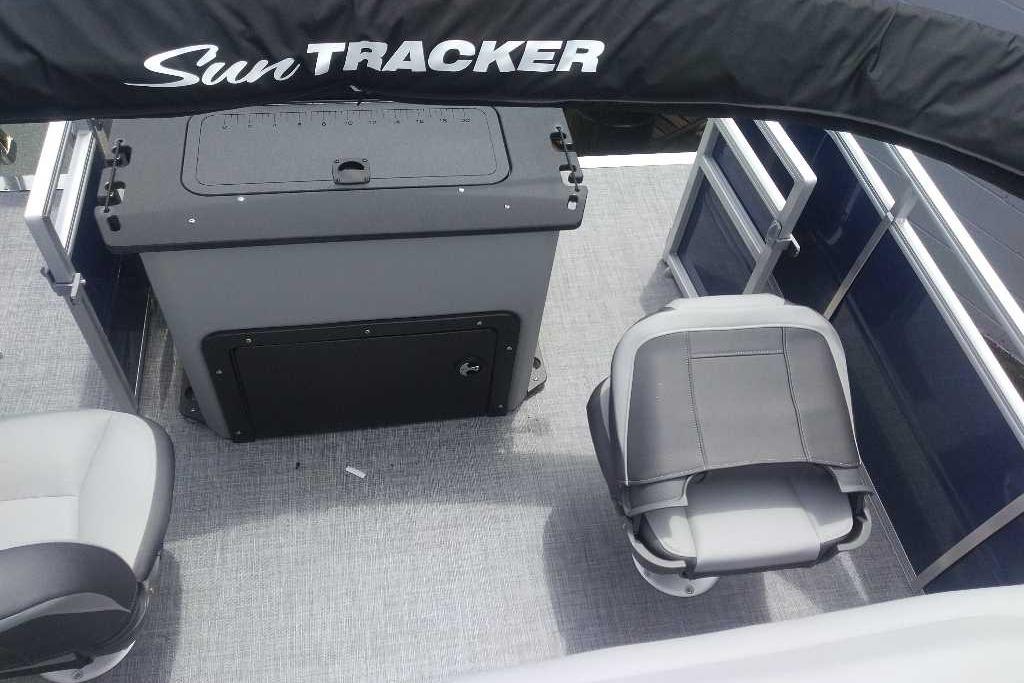 2026 Sun Tracker SportFish 20 DLX interior with seating and storage compartments.