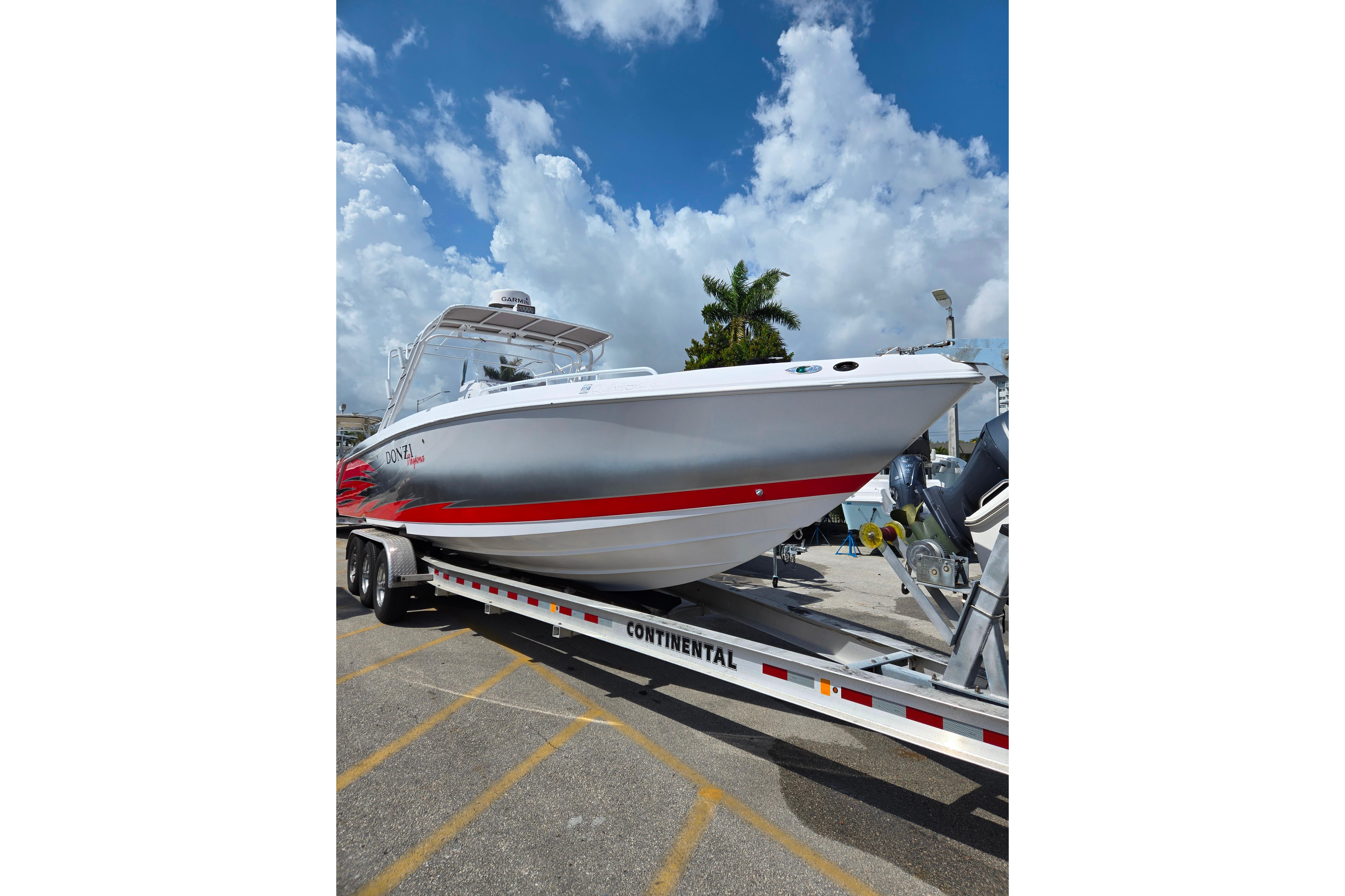 2007 Donzi 35 ZF Daytona boat on trailer under blue sky.