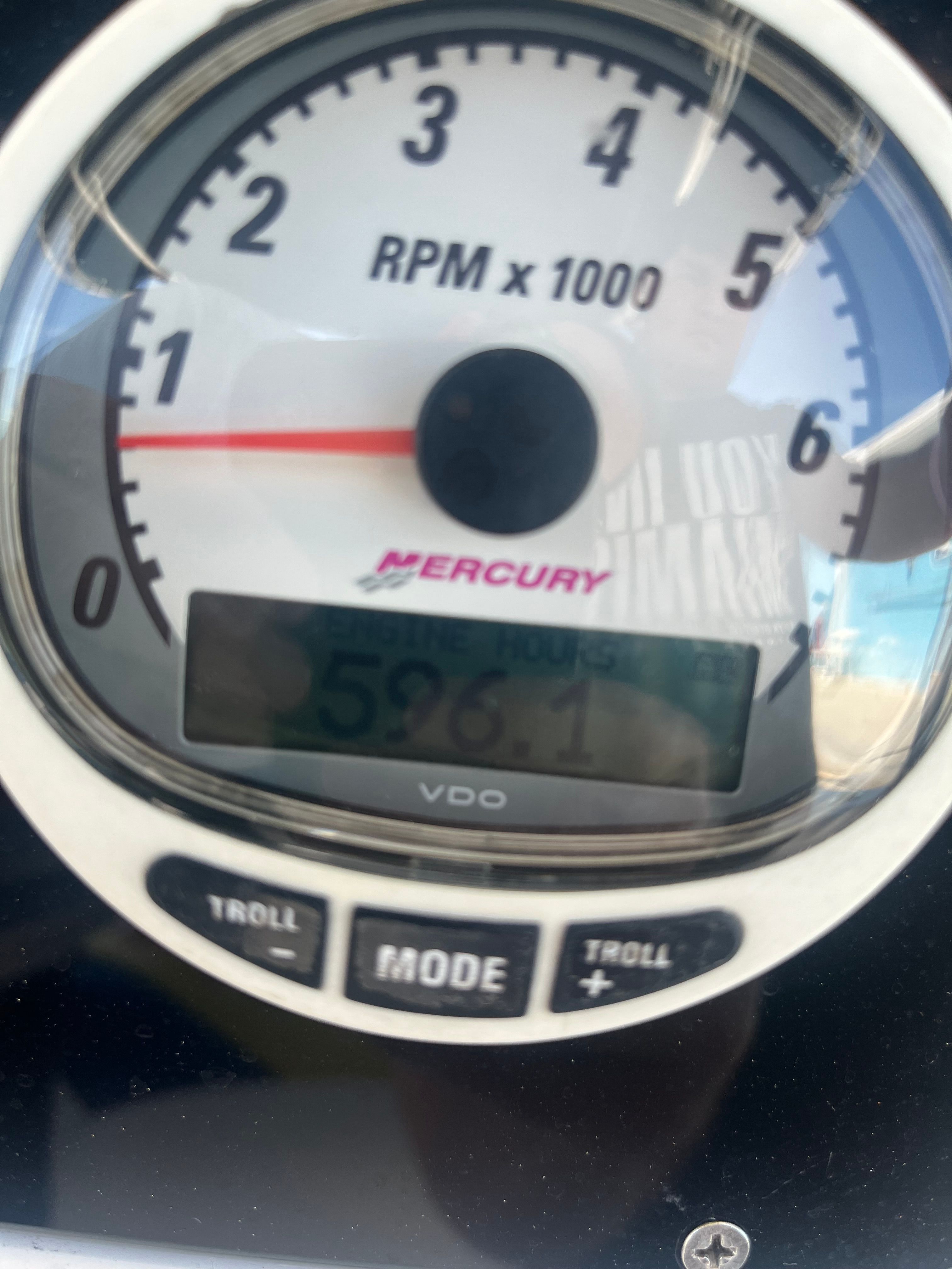 Tachometer of a Donzi 29 ZF boat, displaying 596.1 hours.