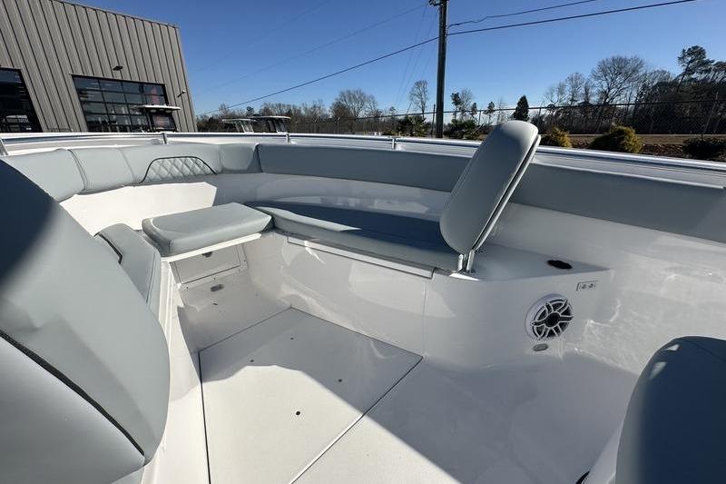 2026 Sportsman Open 282 Center Console boat interior with gray seating and speaker.