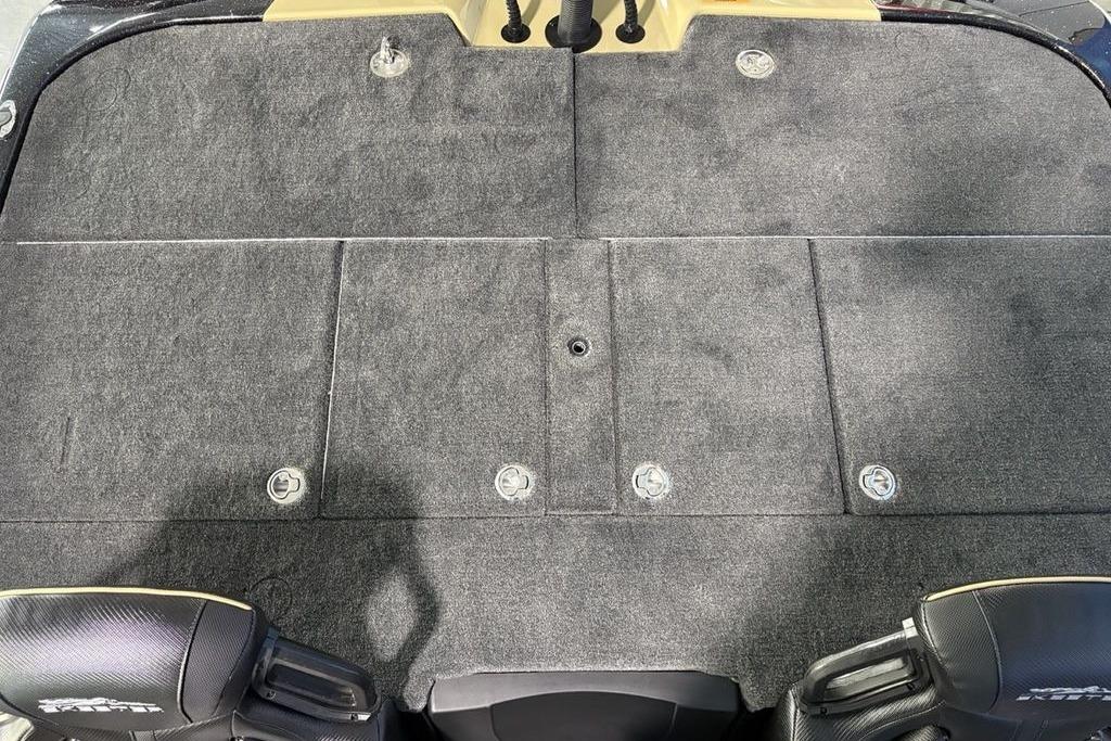 2026 Skeeter ZXE21 boat deck with carpeted surface and storage compartments.