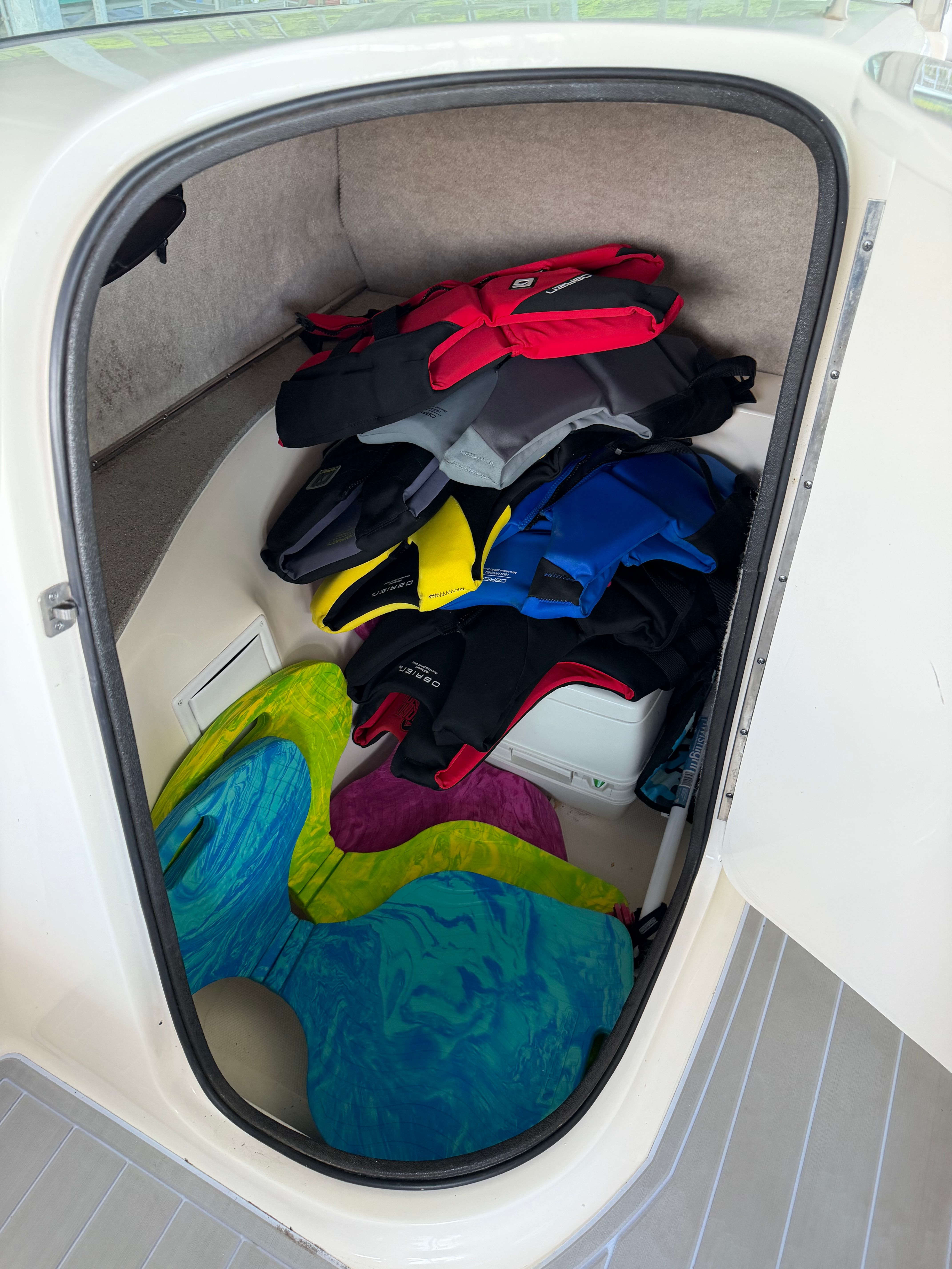 Storage compartment of a 2010 Bryant 255 boat with life jackets.
