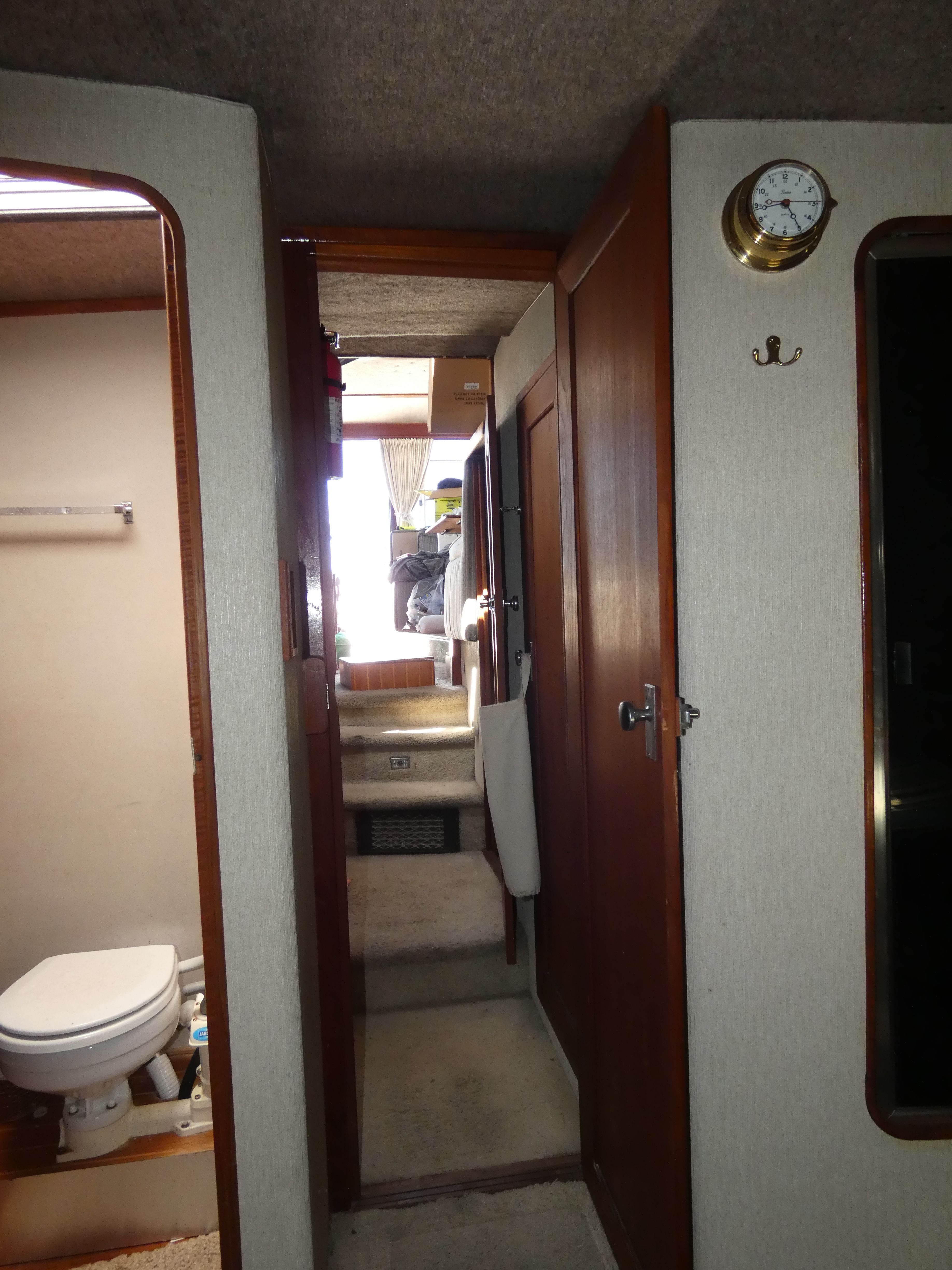 Interior of 1984 Bayliner 3870 Motoryacht featuring bathroom and hallway.