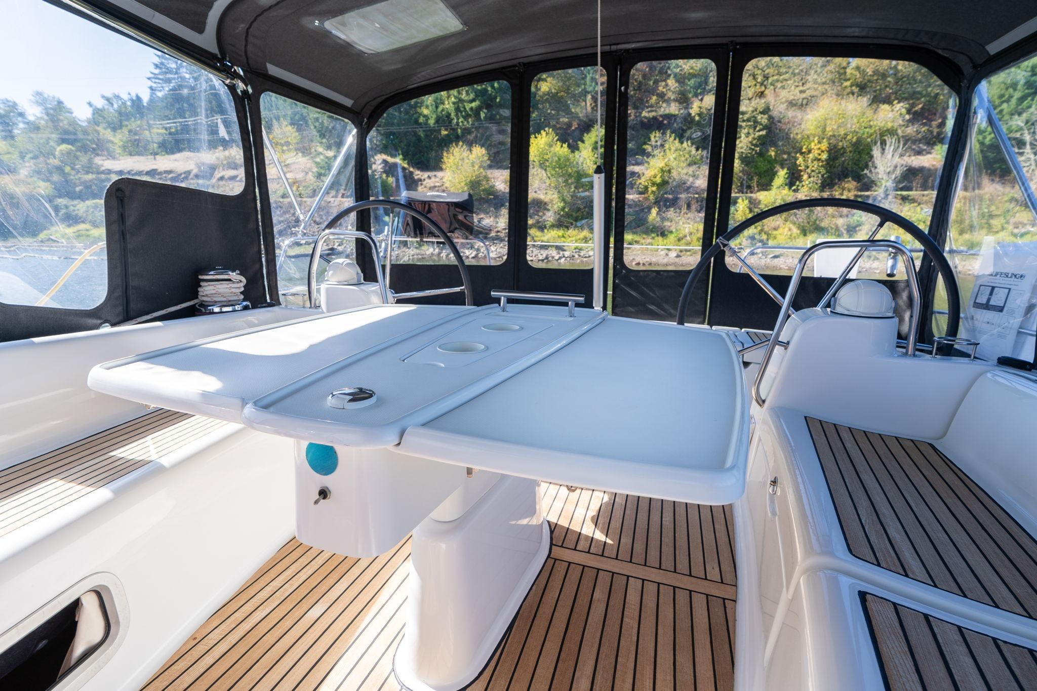 2013 Beneteau Oceanis 50 cockpit with dual steering wheels and teak flooring.