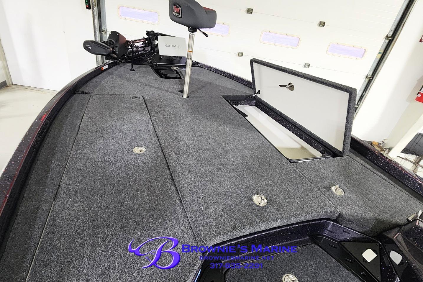 2026 Ranger Z521 boat interior with open storage compartment and Garmin equipment.