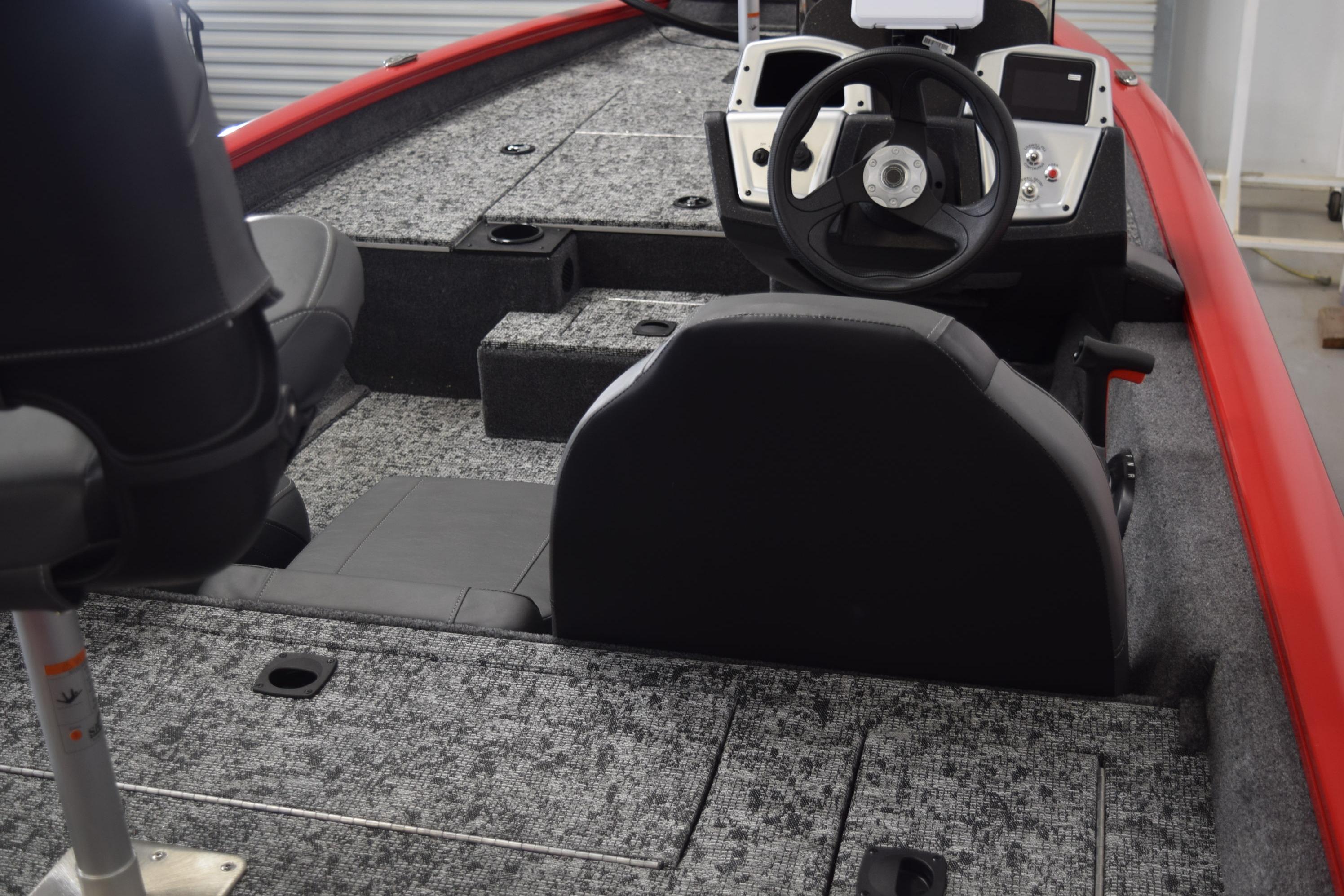2026 Tracker Pro Team 175 boat interior with steering wheel and seating.
