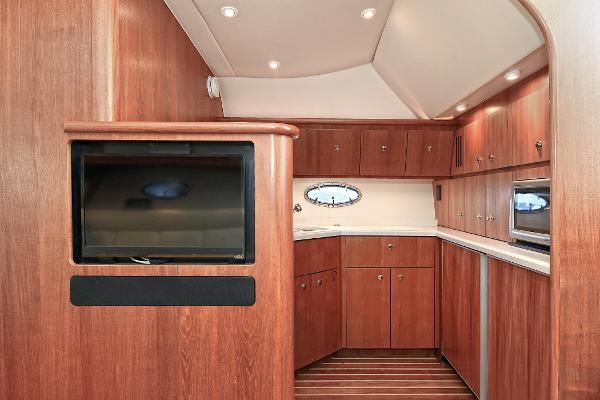 2008 Tiara Yachts 4200 Open interior with wood cabinetry and modern amenities.