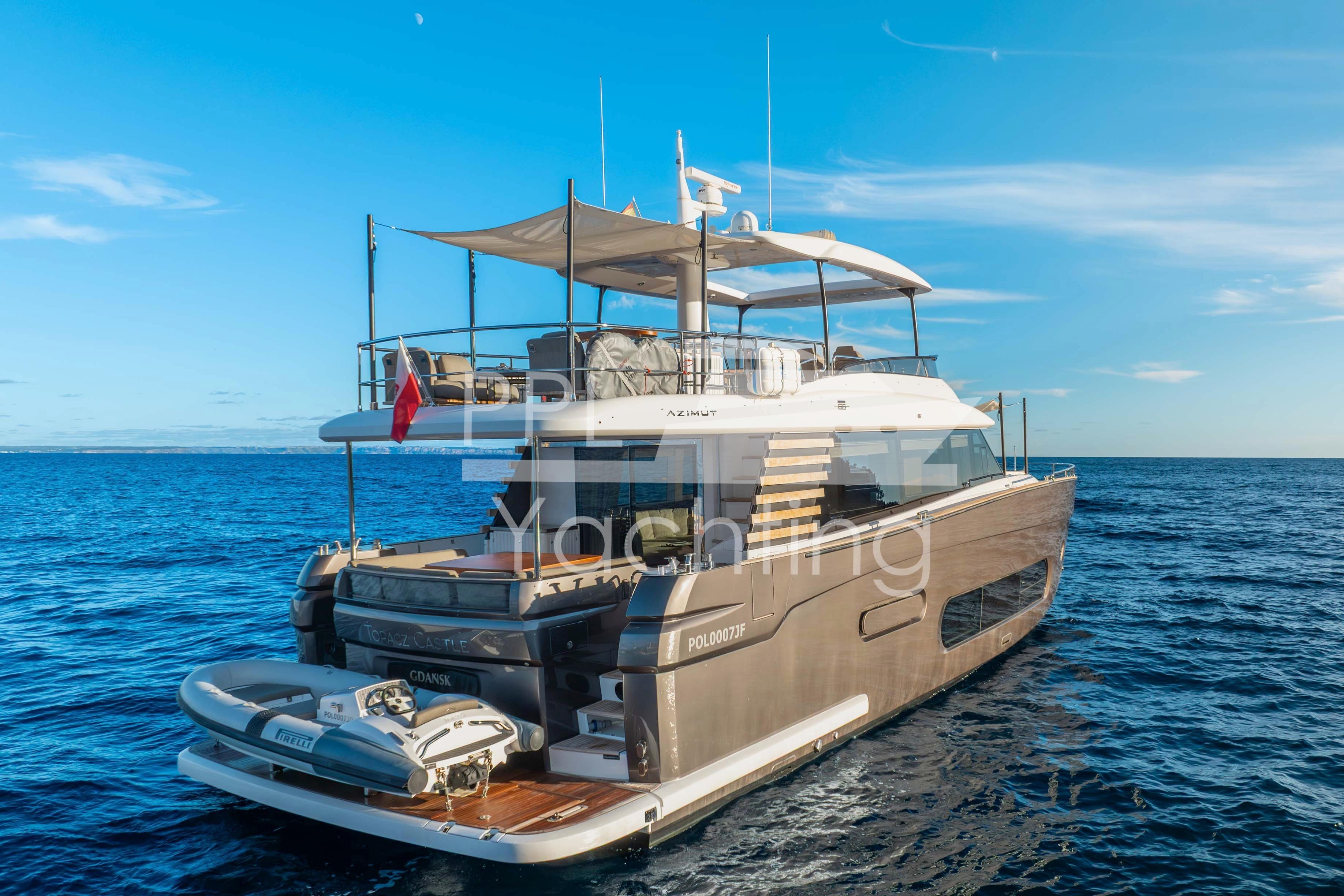 Azimut Magellano 66 yacht, 2021 model, cruising on open sea under clear blue sky.
