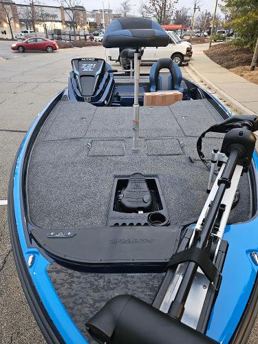 2025 Nitro Z21 XL boat with spacious deck and modern design in a parking lot.
