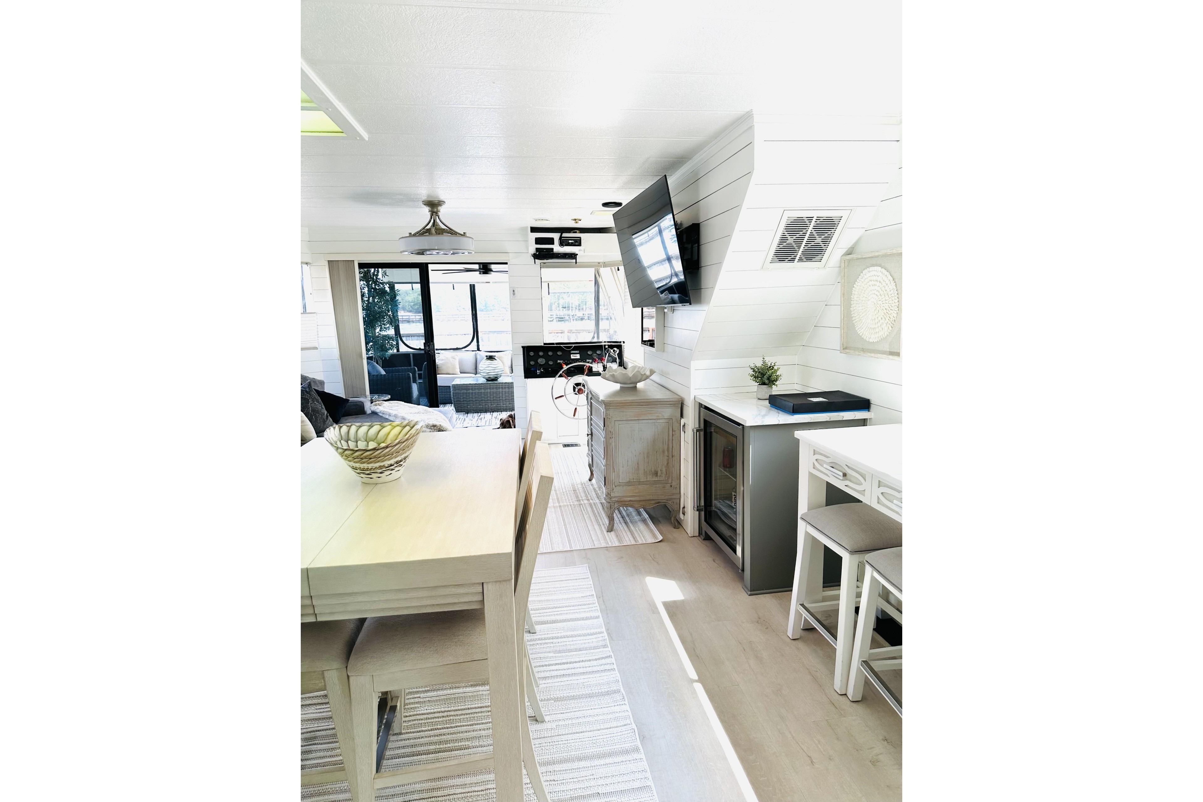Interior of a 1992 Sumerset 66 houseboat with modern decor and dining area.