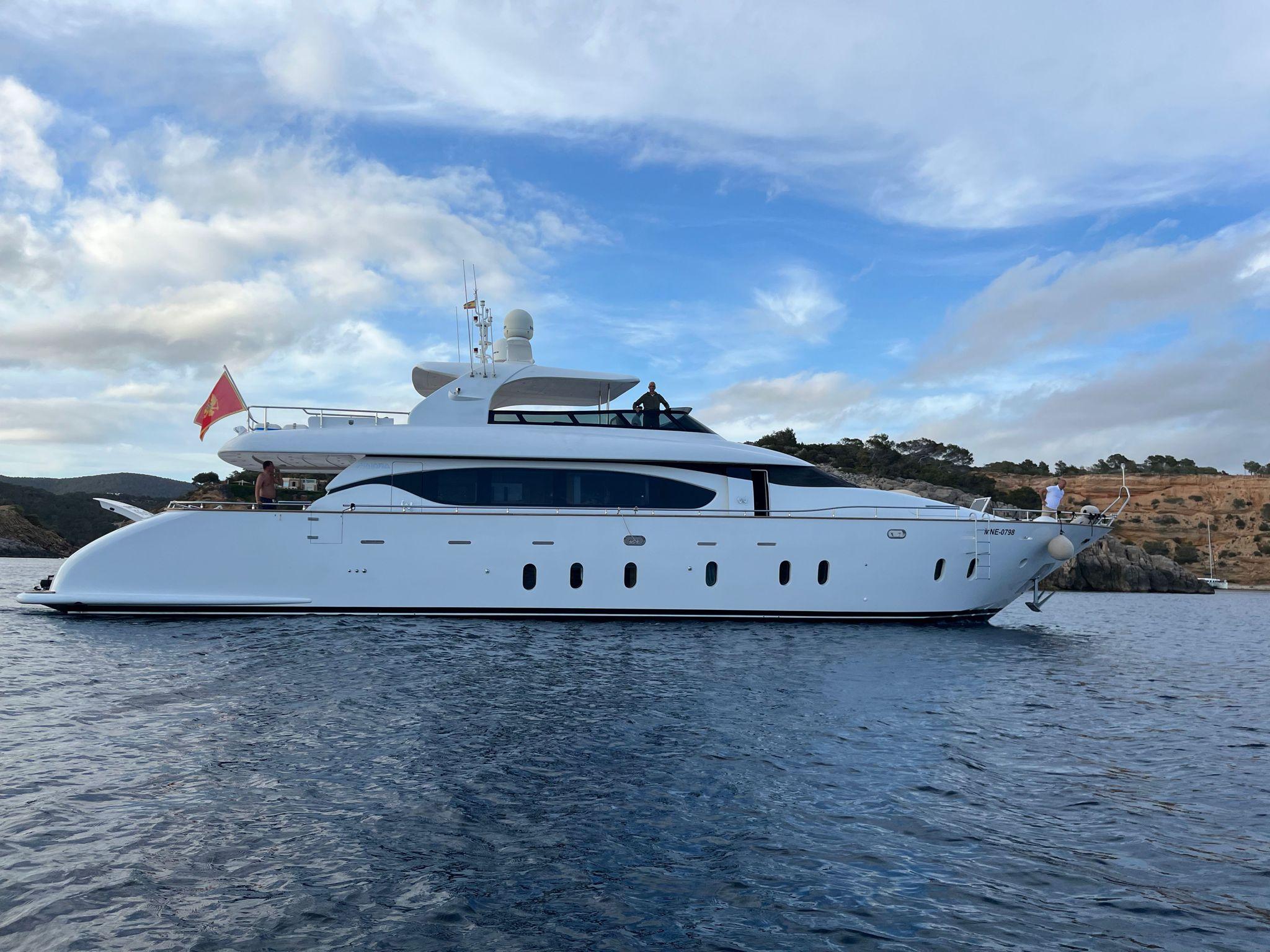 Luxurious 2011 Maiora 27 yacht on calm waters under a partly cloudy sky.