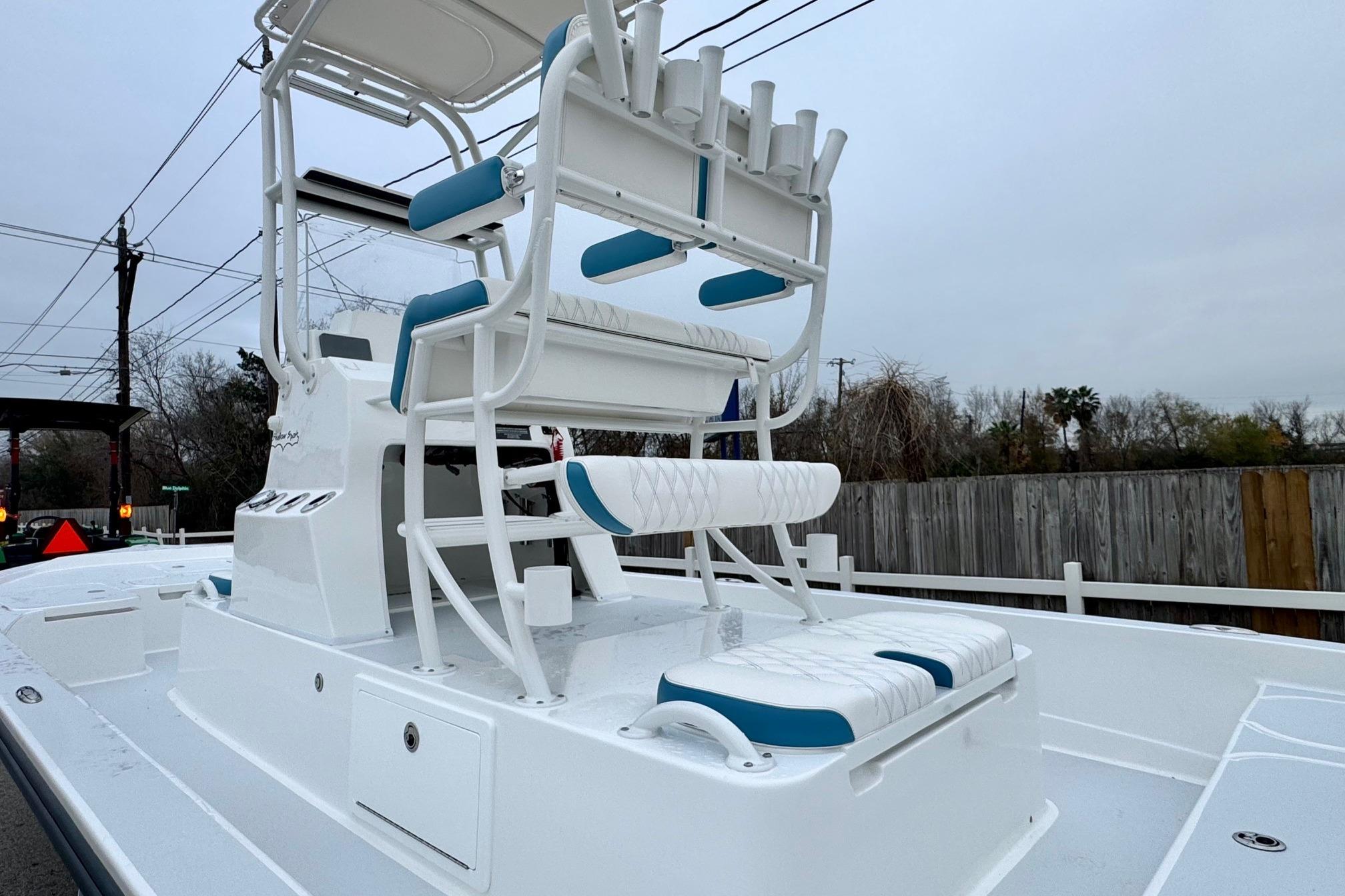 2026 Shallow Sport 24 Modified V boat with elevated seating and rod holders.