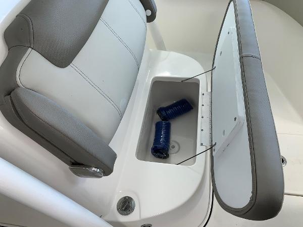 2024 Key West 263 FS boat seat with storage compartment.