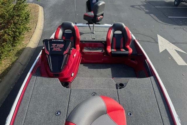 2026 Nitro Z19 XL Pro boat with red and gray seating, parked outdoors.