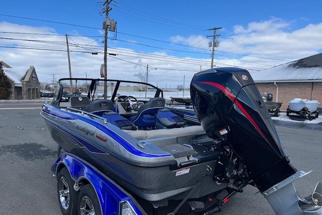 2026 Ranger 1880MS boat with powerful outboard motor, parked outdoors under a clear sky.