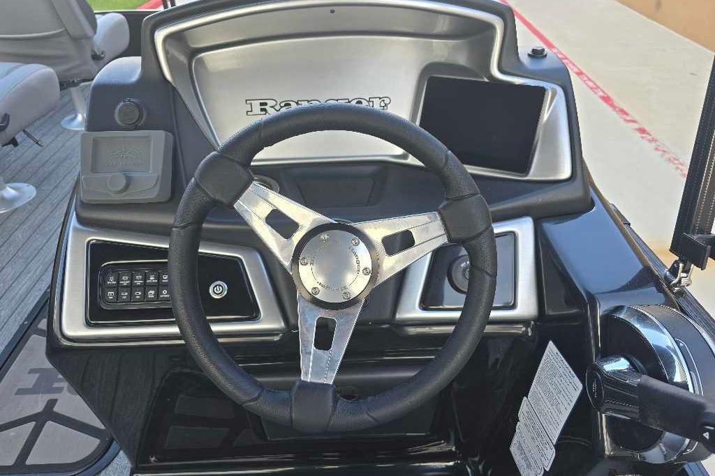 Steering console of 2026 Ranger 223FC boat with modern controls and sleek design.