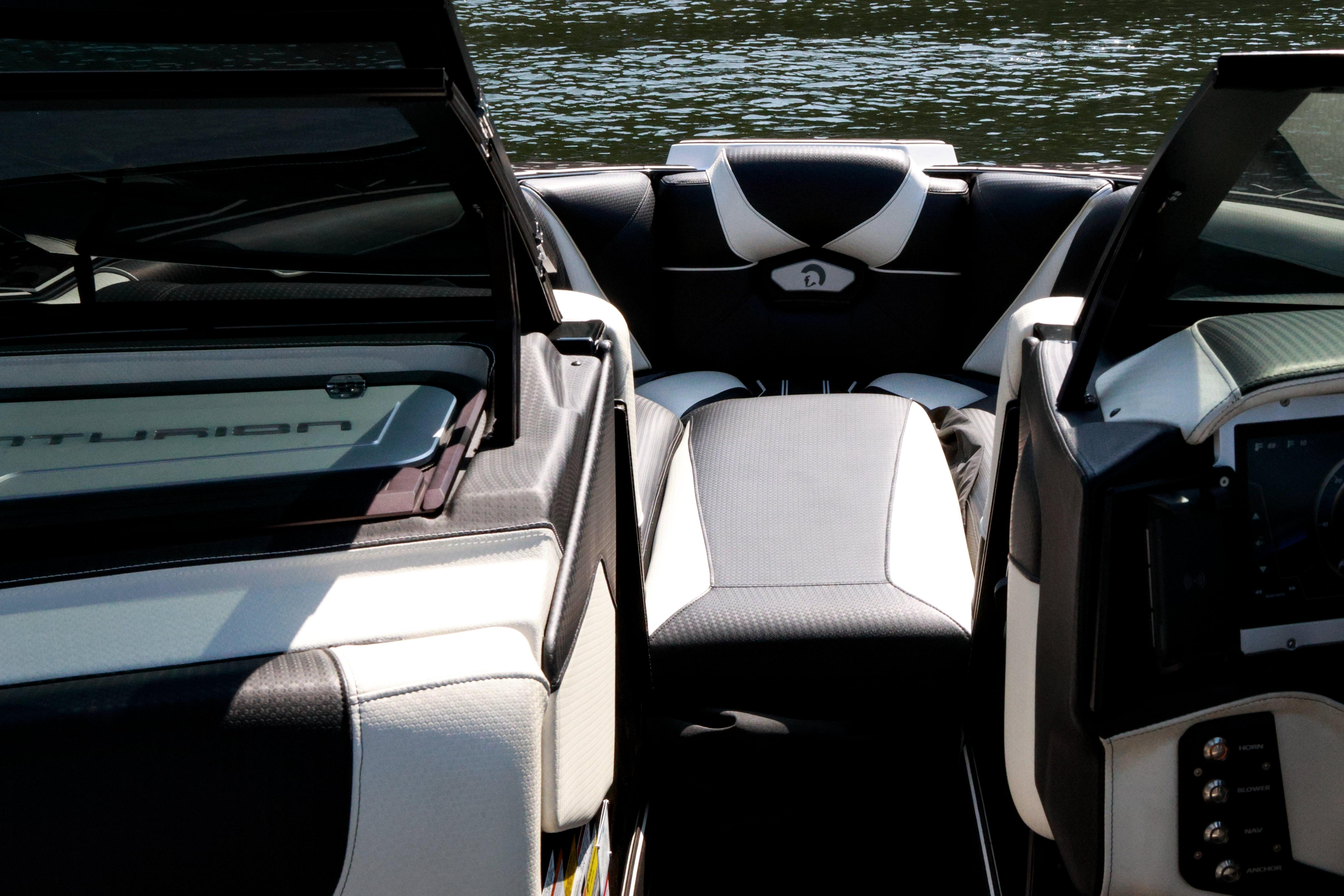 Interior view of 2022 Centurion Ri265 boat with sleek seating and dashboard design.